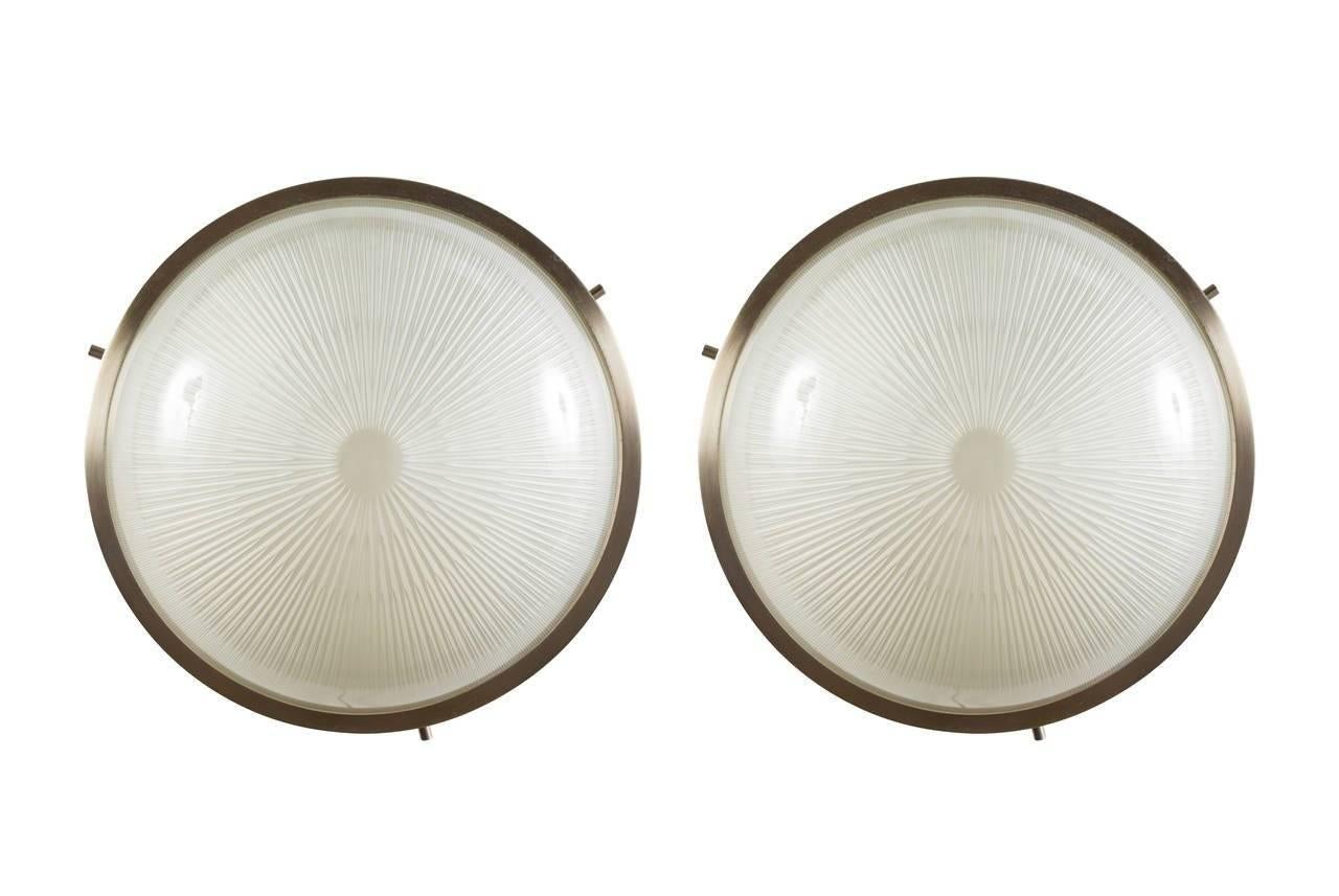 1960s Sergio Mazza 'Sigma' wall or ceiling lights for Artemide, 1960s. Executed in nickeled brass and pressed opaline glass by Sergio Mazza for Artemide, Italy, circa 1960s. Each light has been professionally rewired for US electrical and