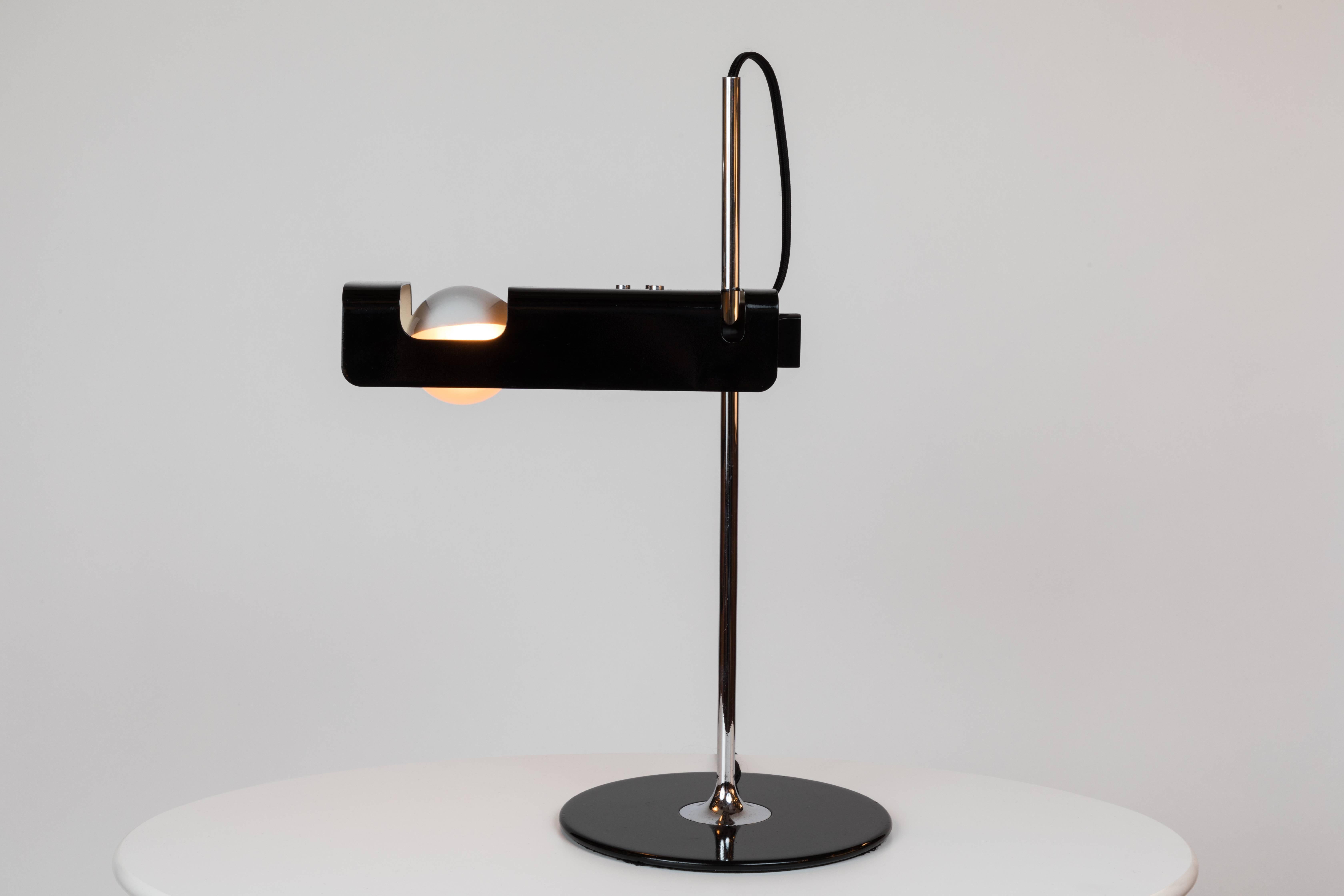 1960s Joe Colombo 'Spider' table lamp for Oluce. Executed in black metal and chrome, this is one of the most refined Minimalist Italian designs of the midcentury and an icon for Colombo. A highly adjustable table light, the shade can be rotated