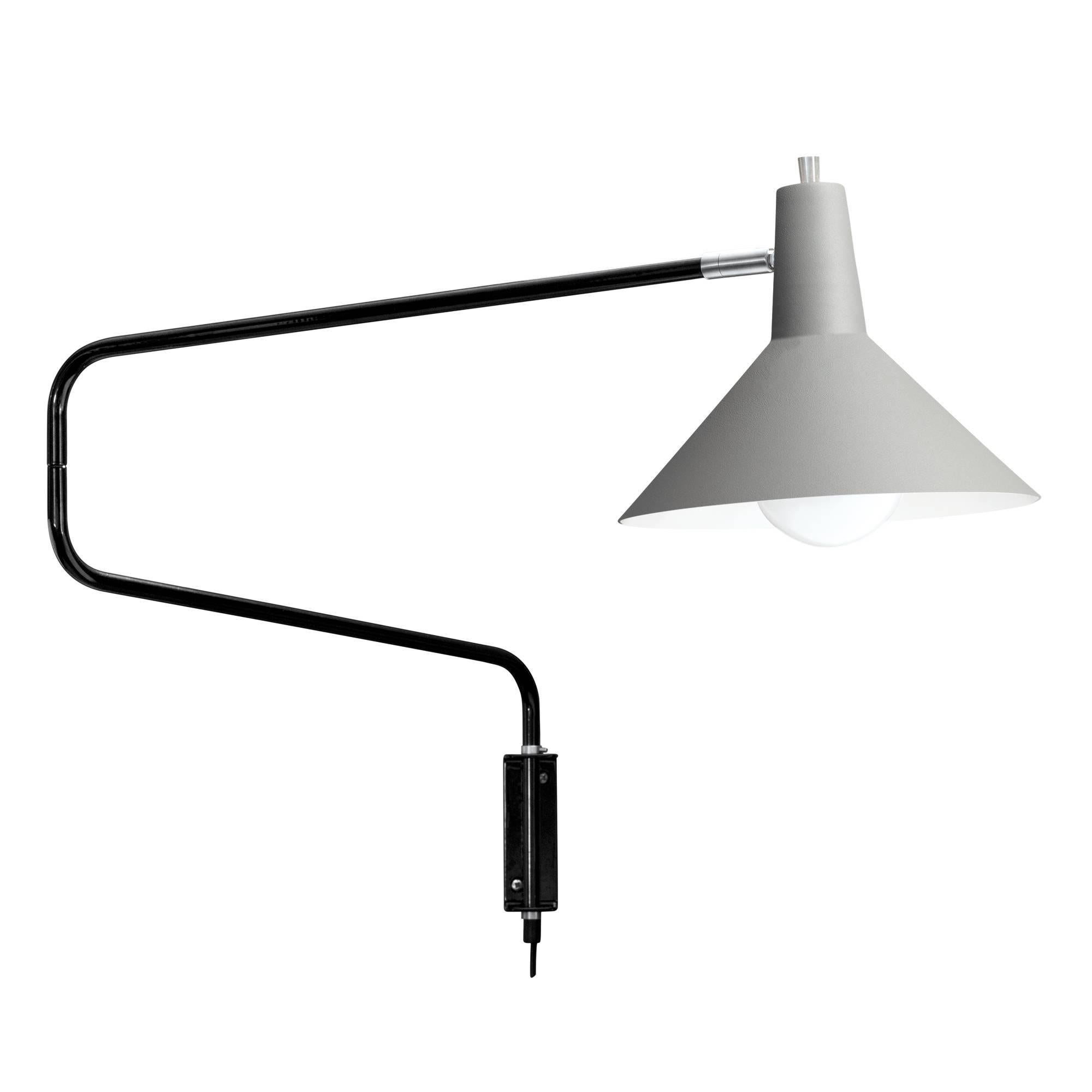 J.J.M. Hoogervorst black paperclip wall light for Anvia. Hoogervorst's most popular, 1950s design, this lamp remains a highly sought after icon of Dutch modernism. The 'elbow' arm when folded measures 27.5 in. wide, but can be extended to a maximum