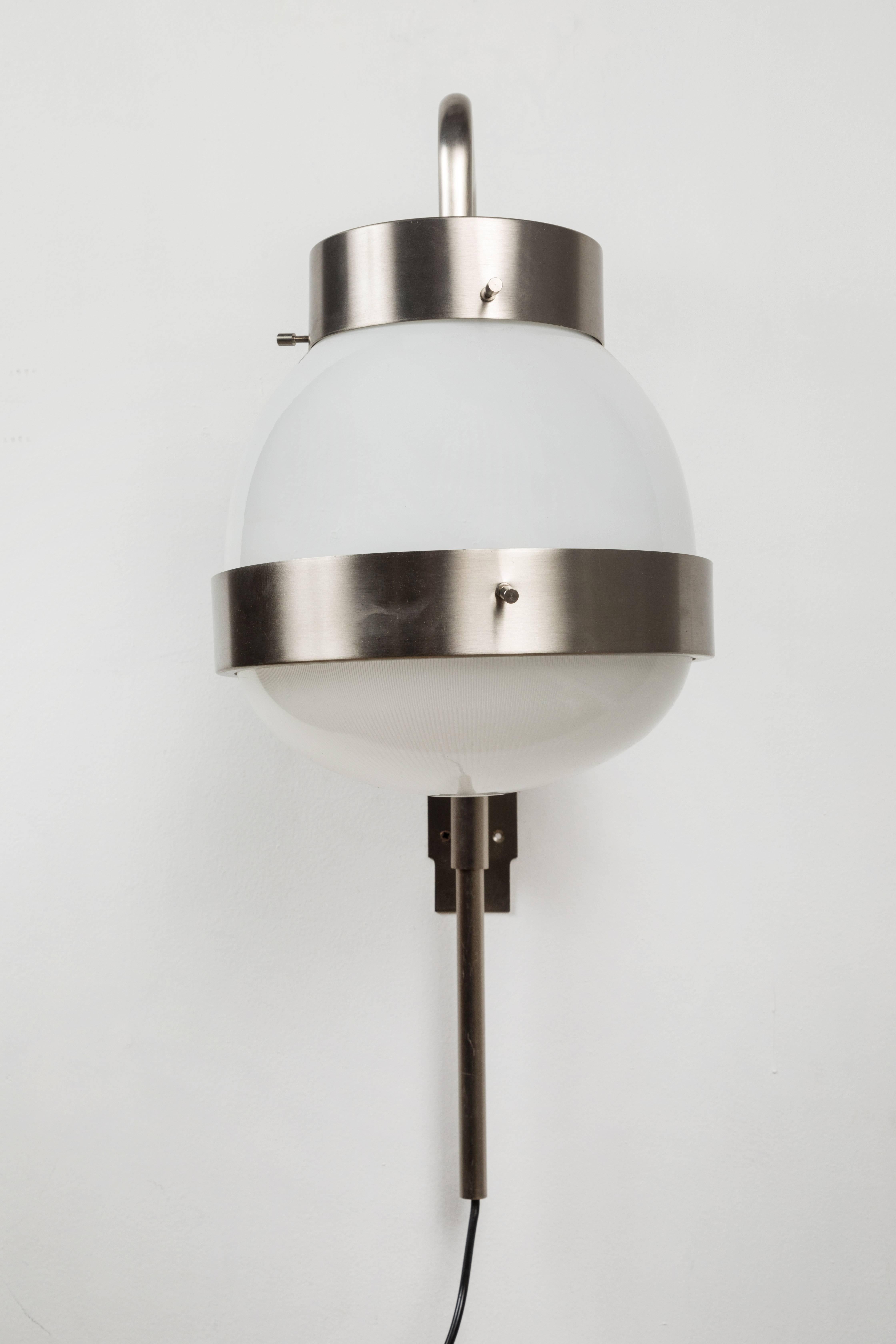 1960s Sergio Mazza 'Delta' wall lights for Artemide. Executed in brushed nickelled brass, pressed and glossy opaline glass. A highly adjustable light that can be rotated left or right as well as up an down. 

Price is per item. 4 available.

Born in