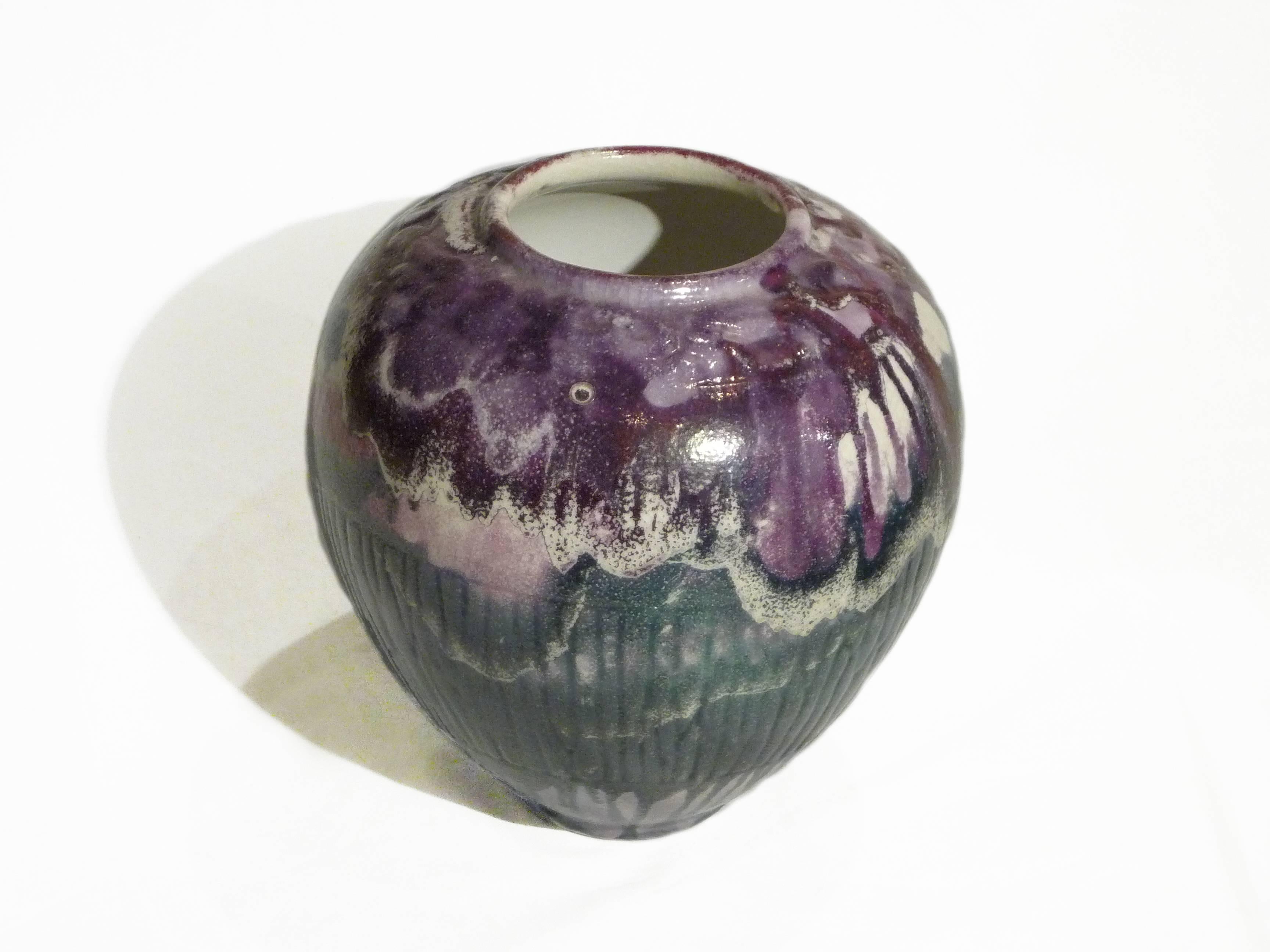 Raoul Lachenal an Art Nouveau earthenware vase decorated with vegetal patterns Mauve, green and white Signed "Raoul Lachenal.".