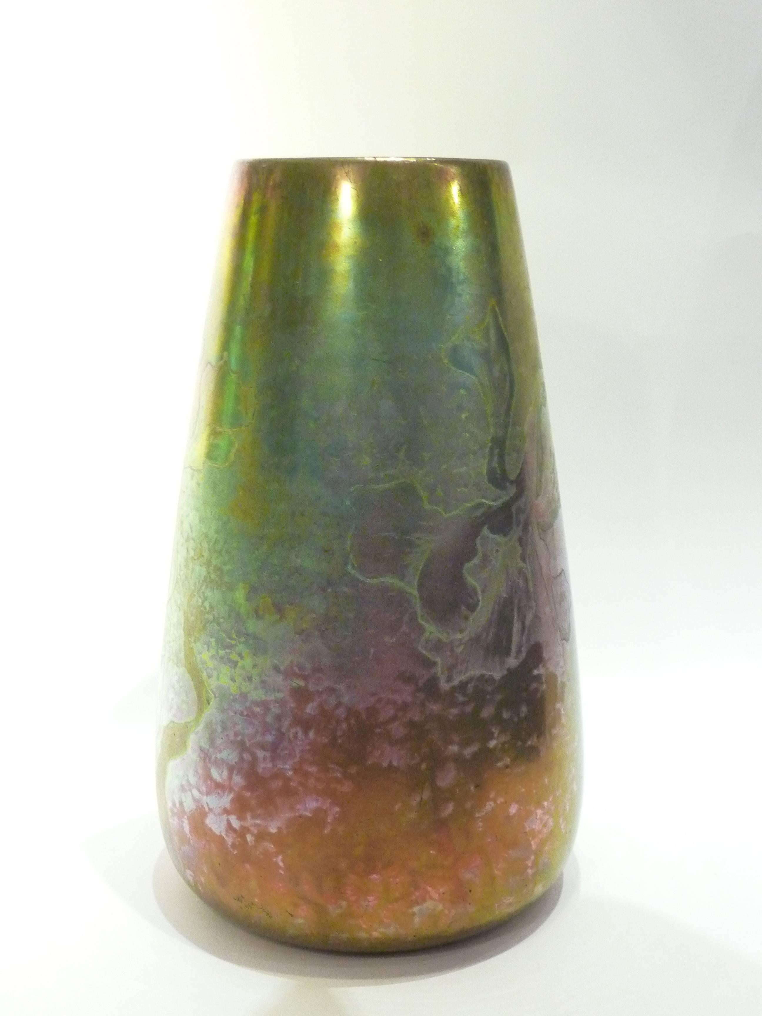 Clément Massier.
An Art Nouveau earthenware vase decorated with a metallic iridescent glaze of irises.
Signed underneath: Clément Massier / Golfe-Juan / A.M.

