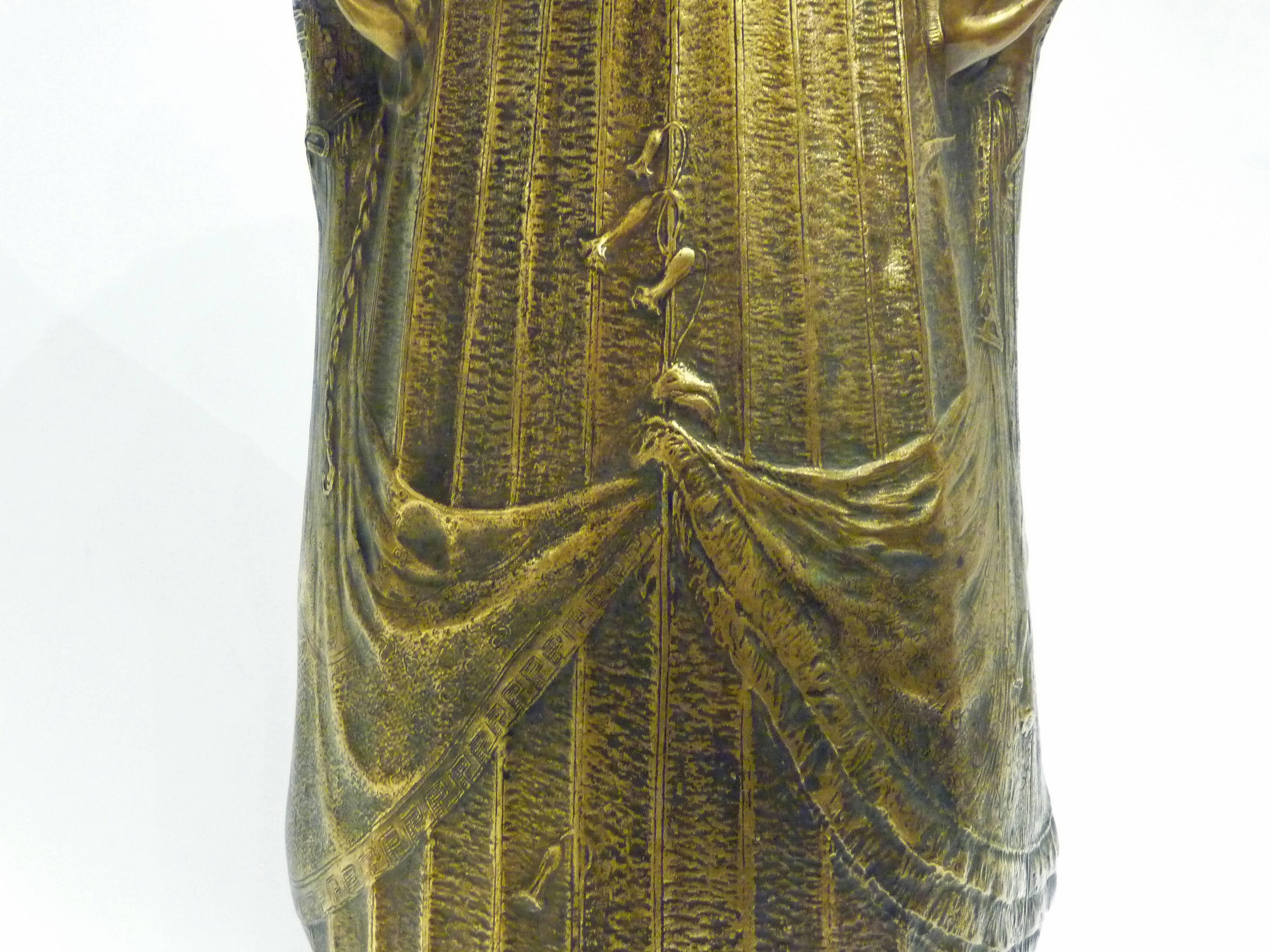 Alexandre Clerget.
Siot-Decauville.
"Jacinthe des bois."
 An Art Nouveau gilt bronze vase.
Signed on the base; bearing the foundry mark and numbered N 590.
Literature: Siot-Decauville, catalogue des bronzes et objets d'art, ill. pl.