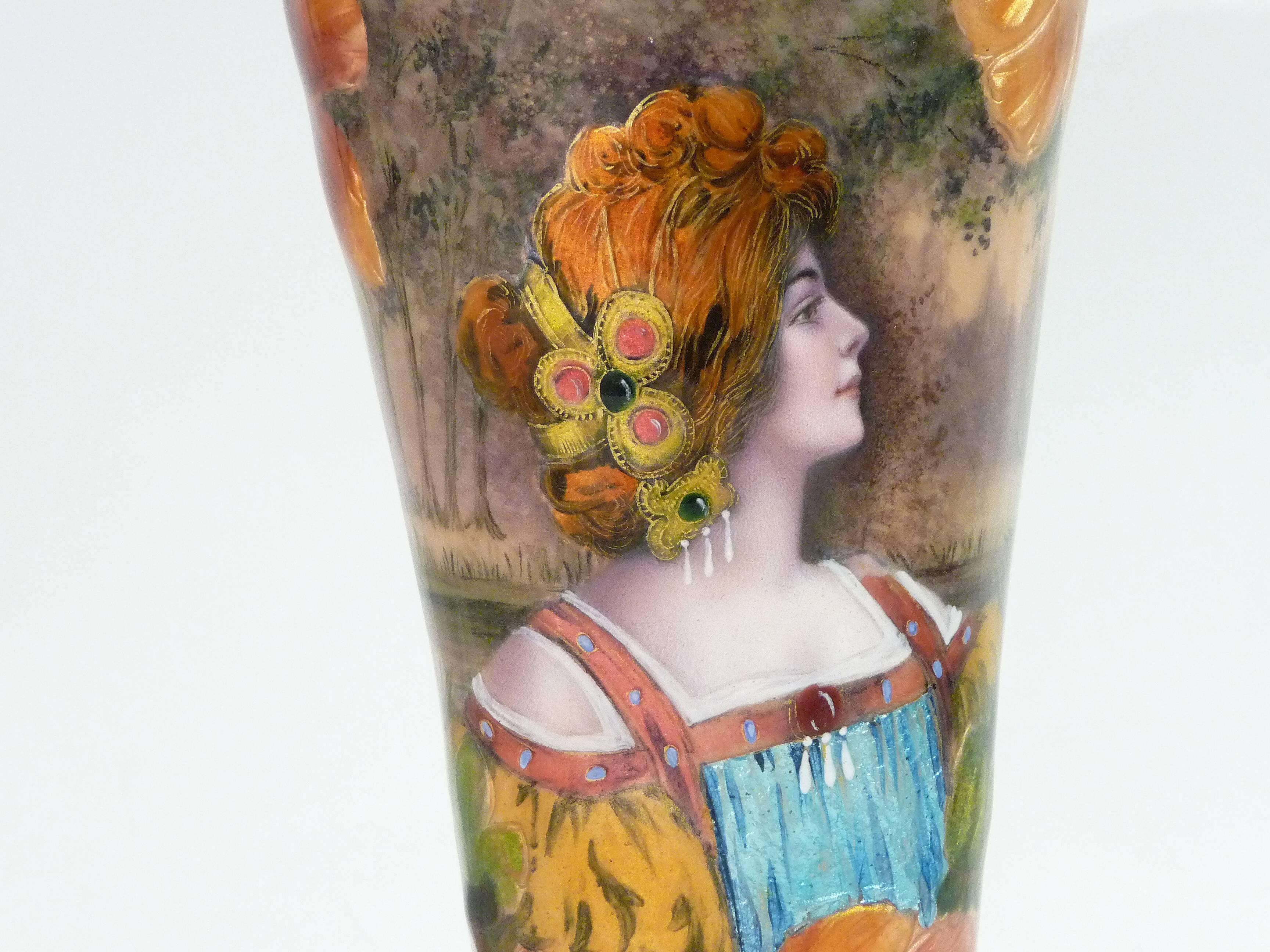 Anonymous.
An Art Nouveau enamel on copper vase featuring a woman and flowers on a landscape background.
Signed Borval.