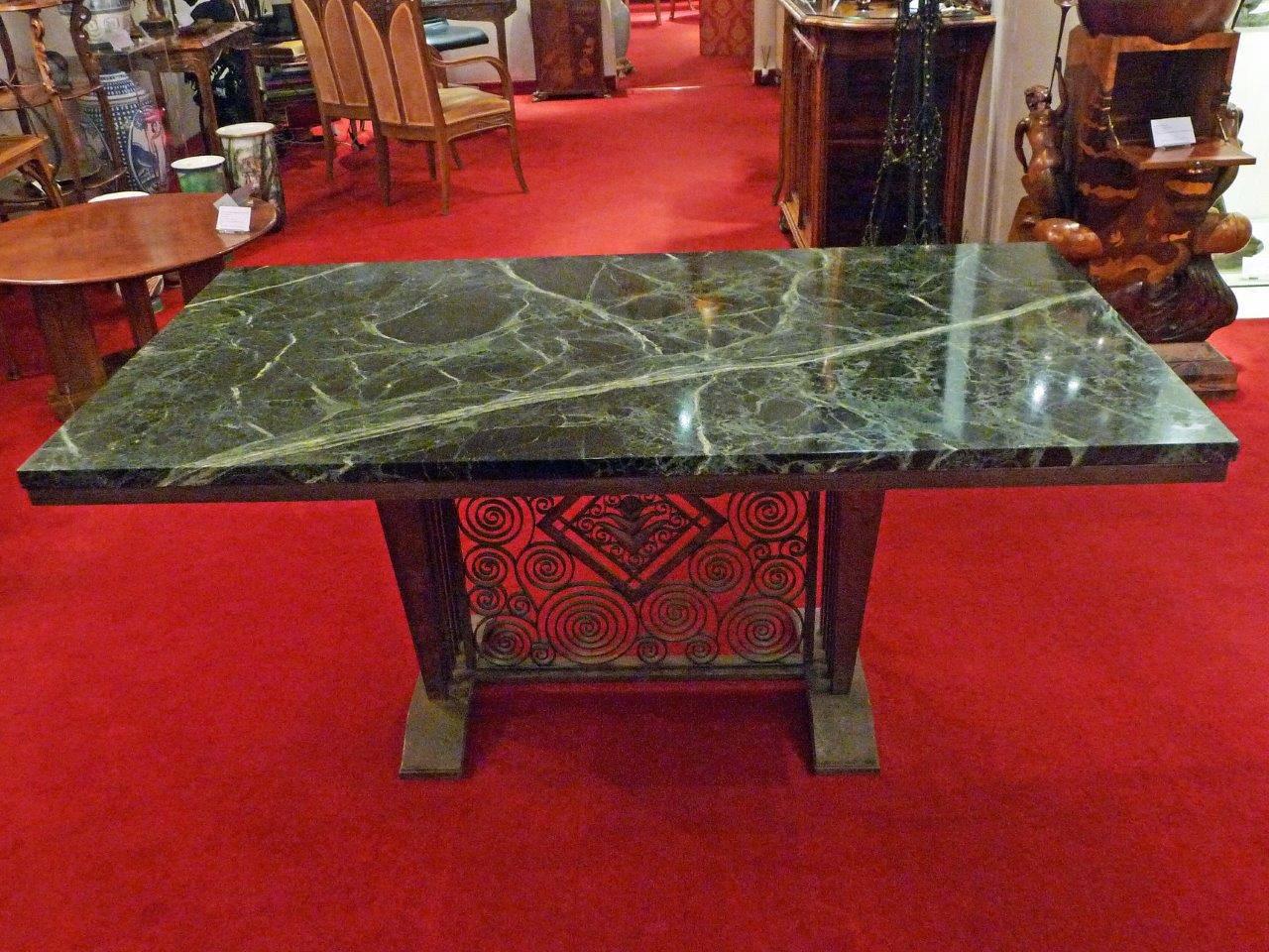 Edgar Brandt.
A green marble and wrought iron table.
Stamped E Brandt.