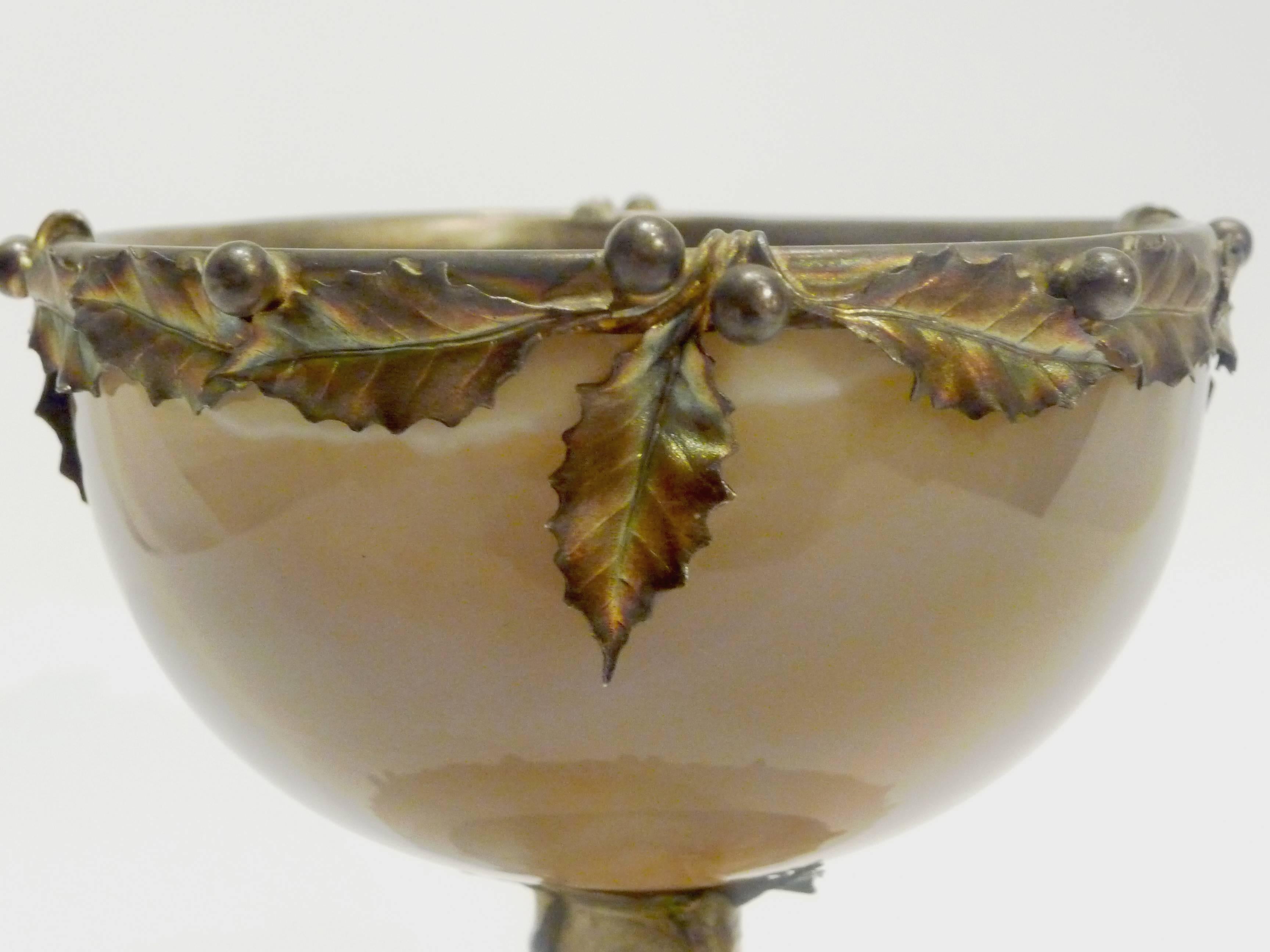 Anonymous
An Art Nouveau cup in agate; silver mount decorated with holly
with makers' mark.