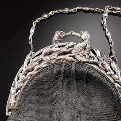 A. Arnould, an Art Nouveau Purse in Chased Silver, Signed