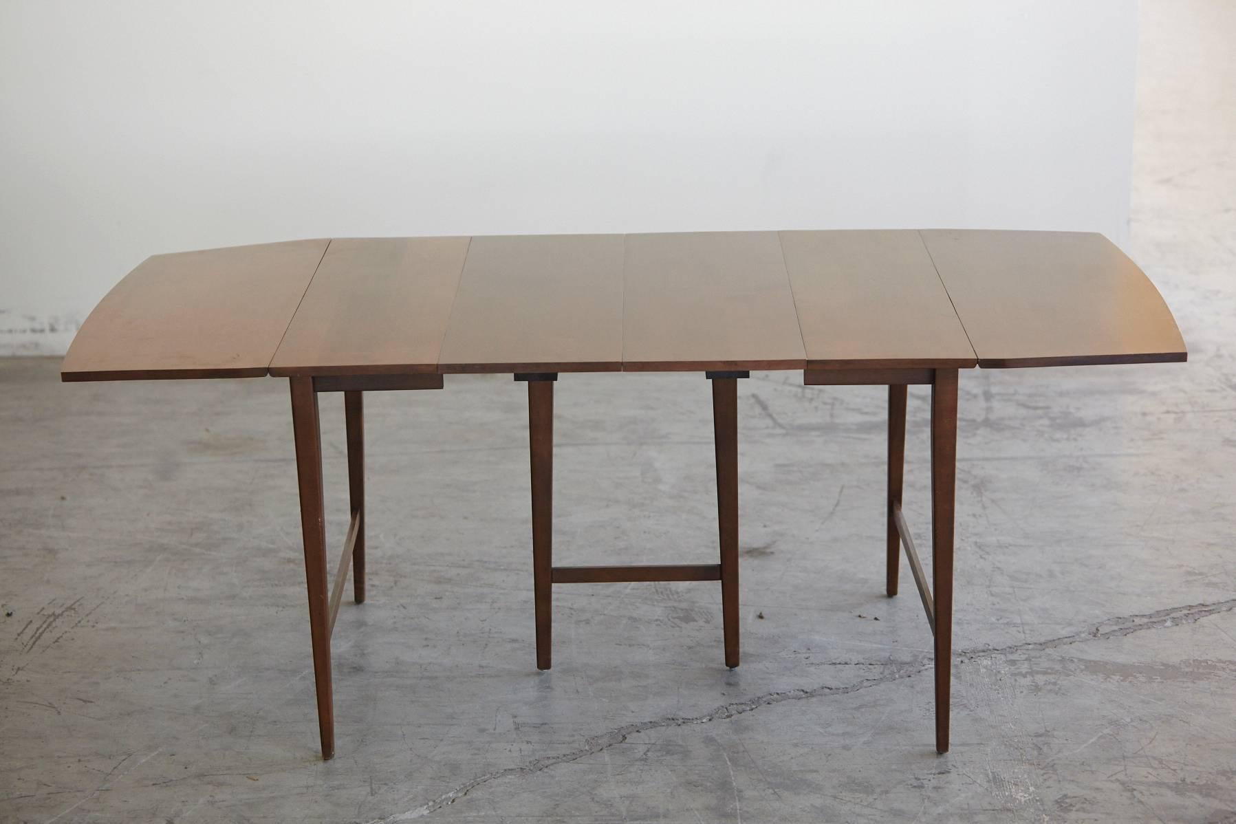 Extendable solid maple drop-leaf dining table with three 12