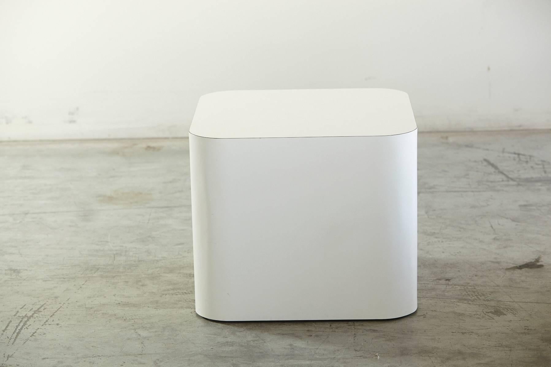 Custom-made white laminate cubic end table, pedestal, or display table.
The laminate is pure white and not yellowed.
 A simple, clean, minimalistic table.