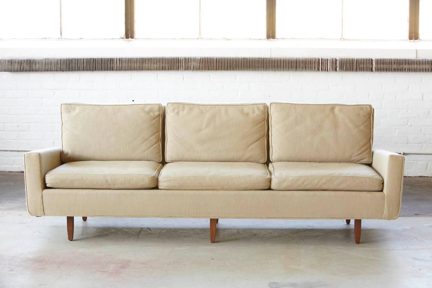 Original, early Florence Knoll sofa from 1967. A copy of the original Knoll Associates sales order and the invoice dating 05/16/1967 will be included. 
Solid square walnut legs with oil finish.
Model # 26D, 14 yards of fabric, # KL 64 - putty or