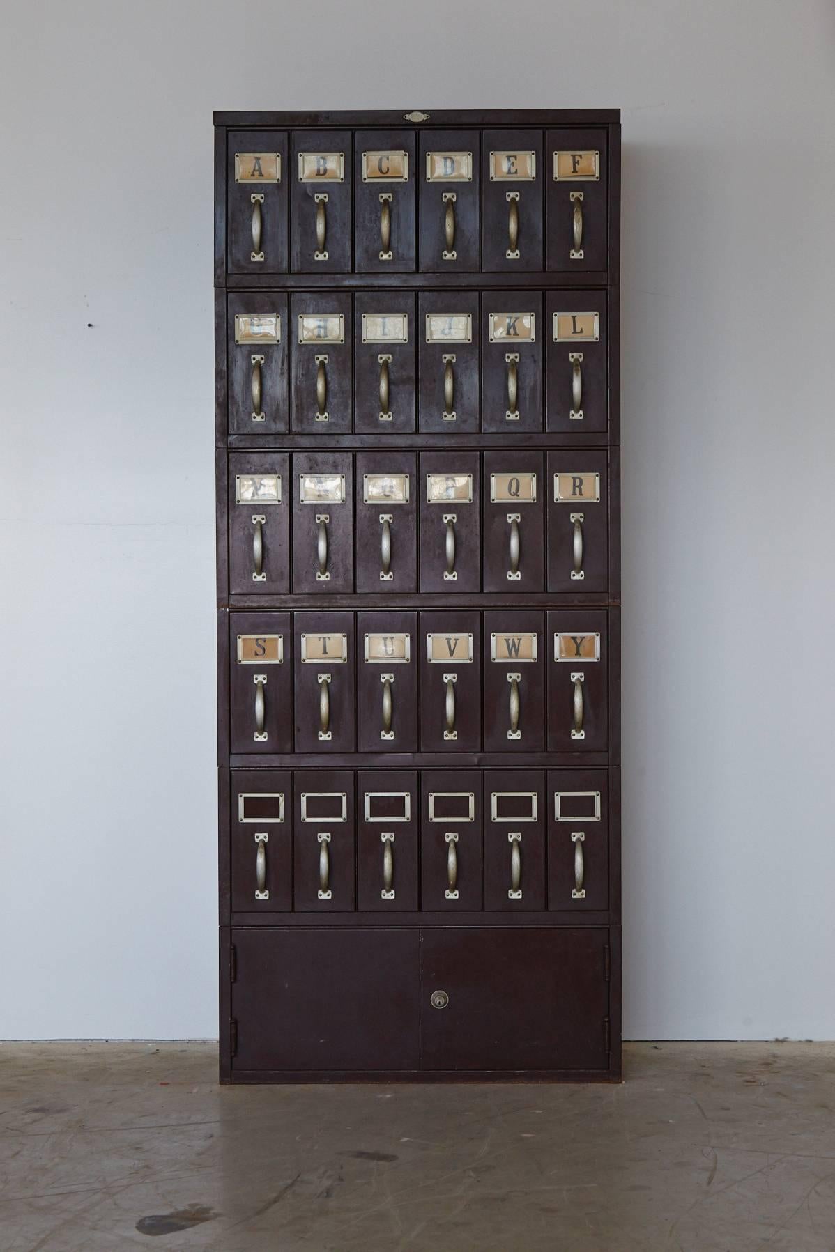 Large Industrial painted steel legal filing cabinet with 30 drawers, made by Art Metal, Jamestown NY.
All original handles and placeholders with all original plastic cards and complete alphabet.
Great patina.