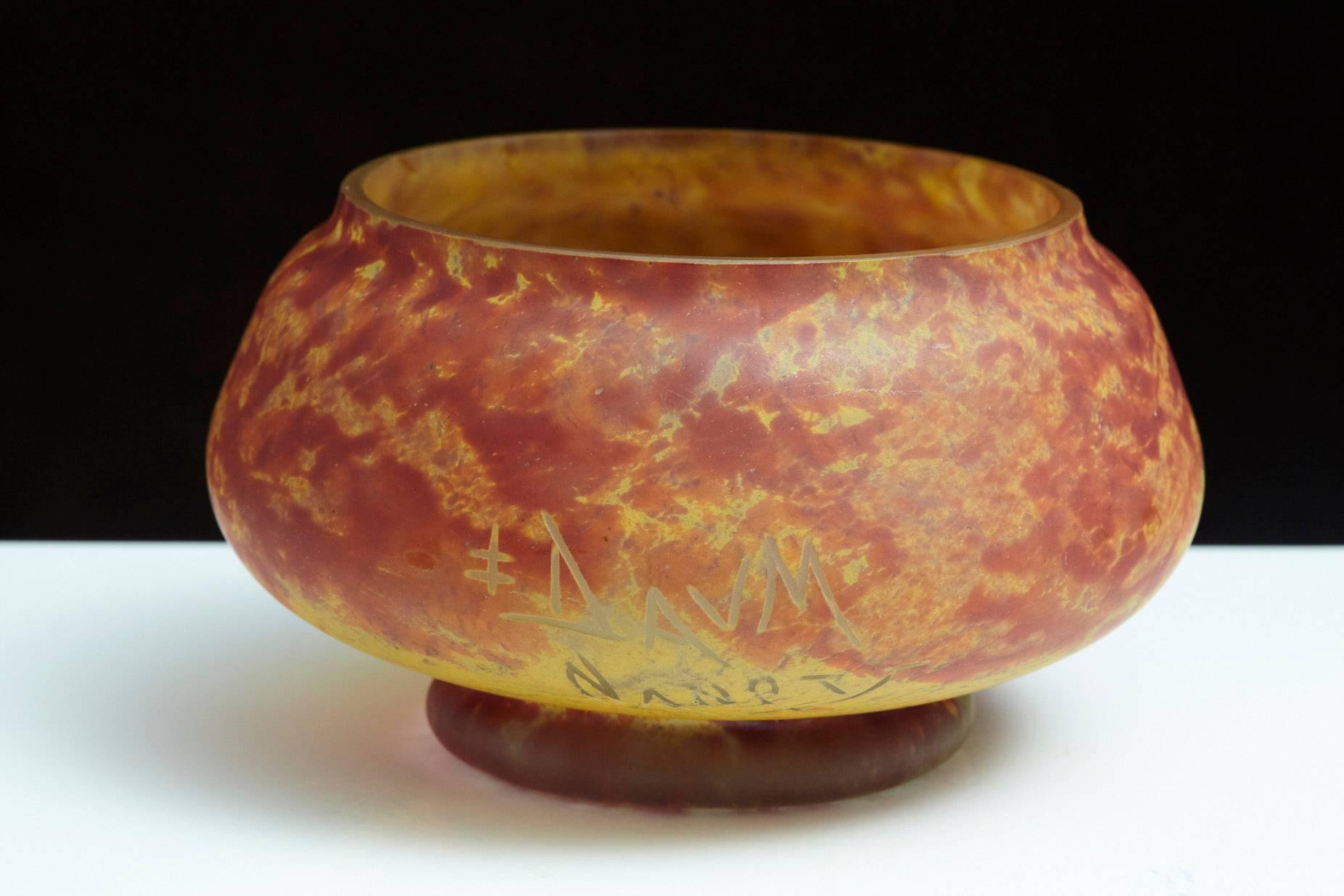 French Art Nouveau orange, yellow and red mottled glass / pâte de verre bowl, signed (etched into the glass) Daum Nancy and La Croix de Lorraine.
There is one minor flea bite to the edge, please refer to the photo, otherwise the bowl is in a very
