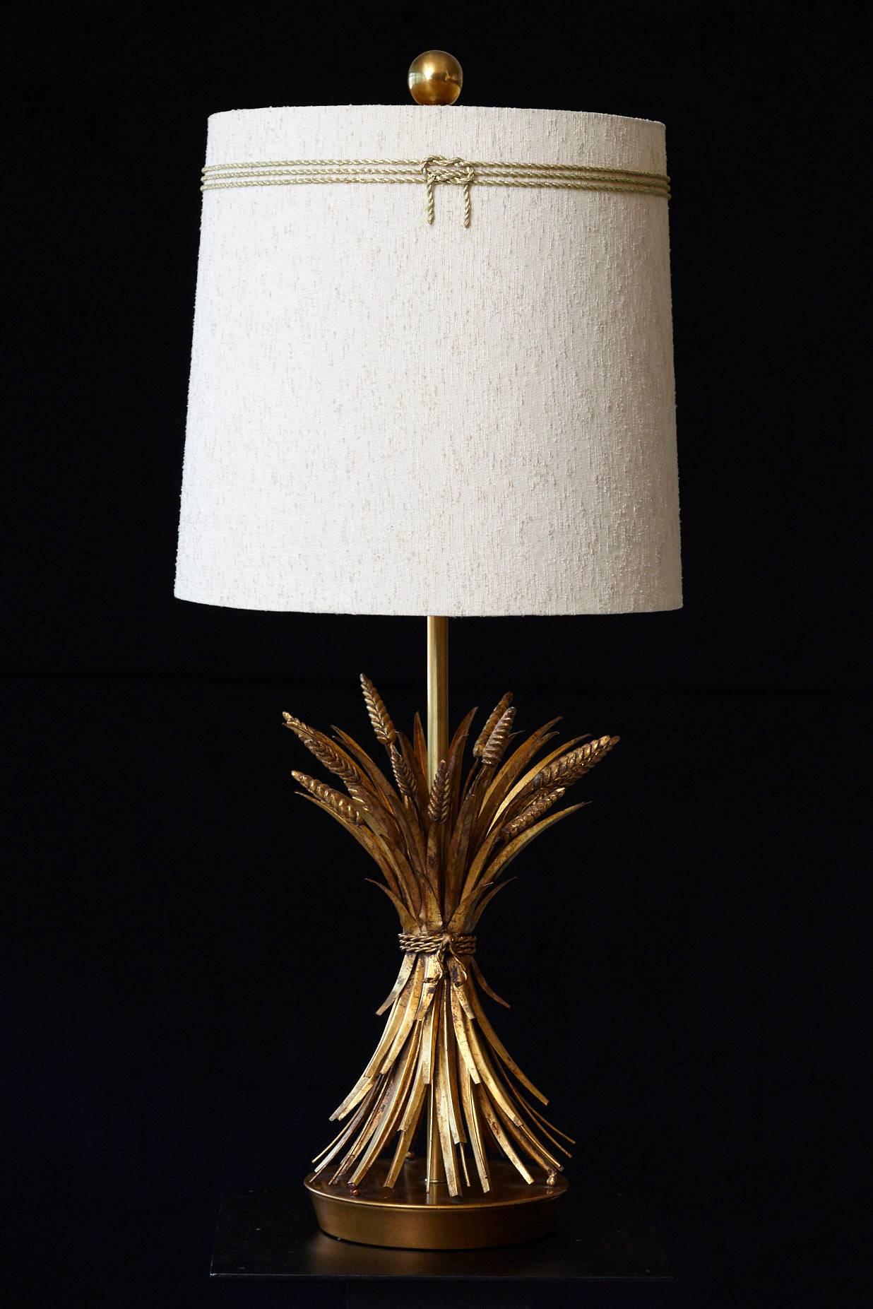 Impressive sheaf of wheat gilt metal table lamp by Marbro. The lamp has a brushed brass base and gilt tole metal wheat sheafs. 
We have a second wheat sheaf table lamp available by the same manufacturer, the same model, which is slightly different