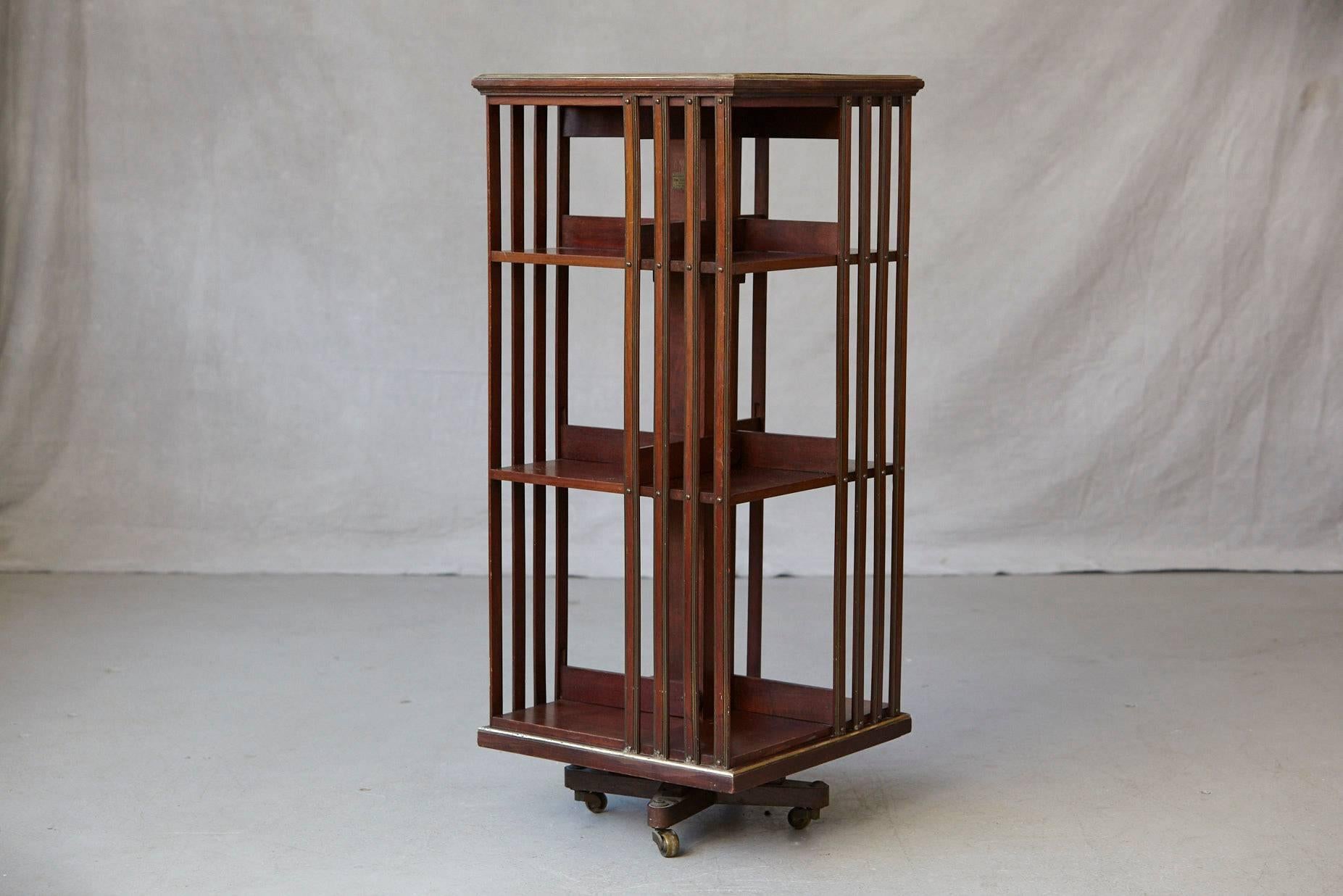 Antique French Revolving Mahogany Bookcase on Raised Casters with Brass Trim In Good Condition In Pau, FR