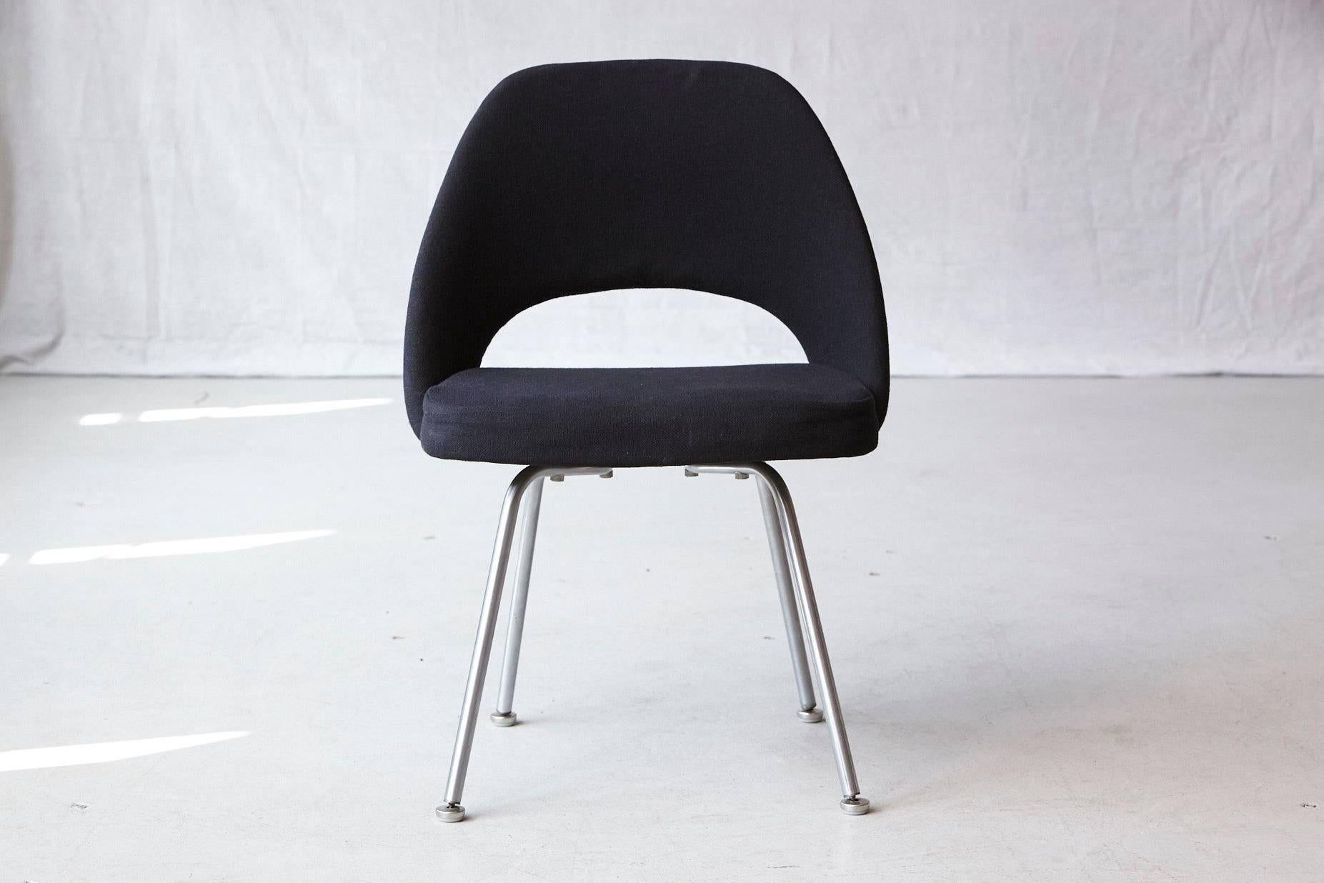 Original Eero Saarinen executive armless side or dining chair in black wool fabric with chrome legs. 
Some fading to the original wool fabric and foam is a little hardened.