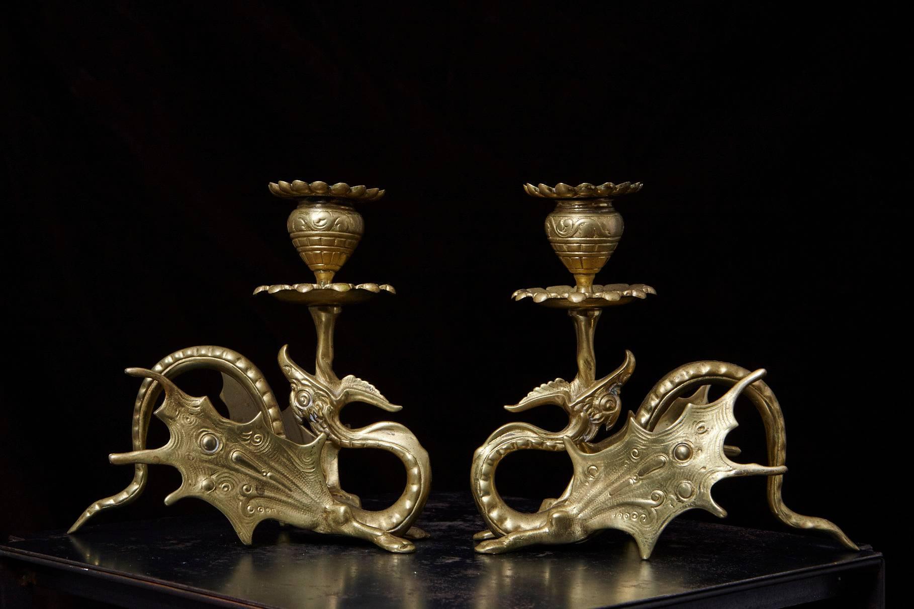 Lovely pair of Victorian winged dragon solid brass candleholders, with removable candle cup tops. Age appropriate patina.