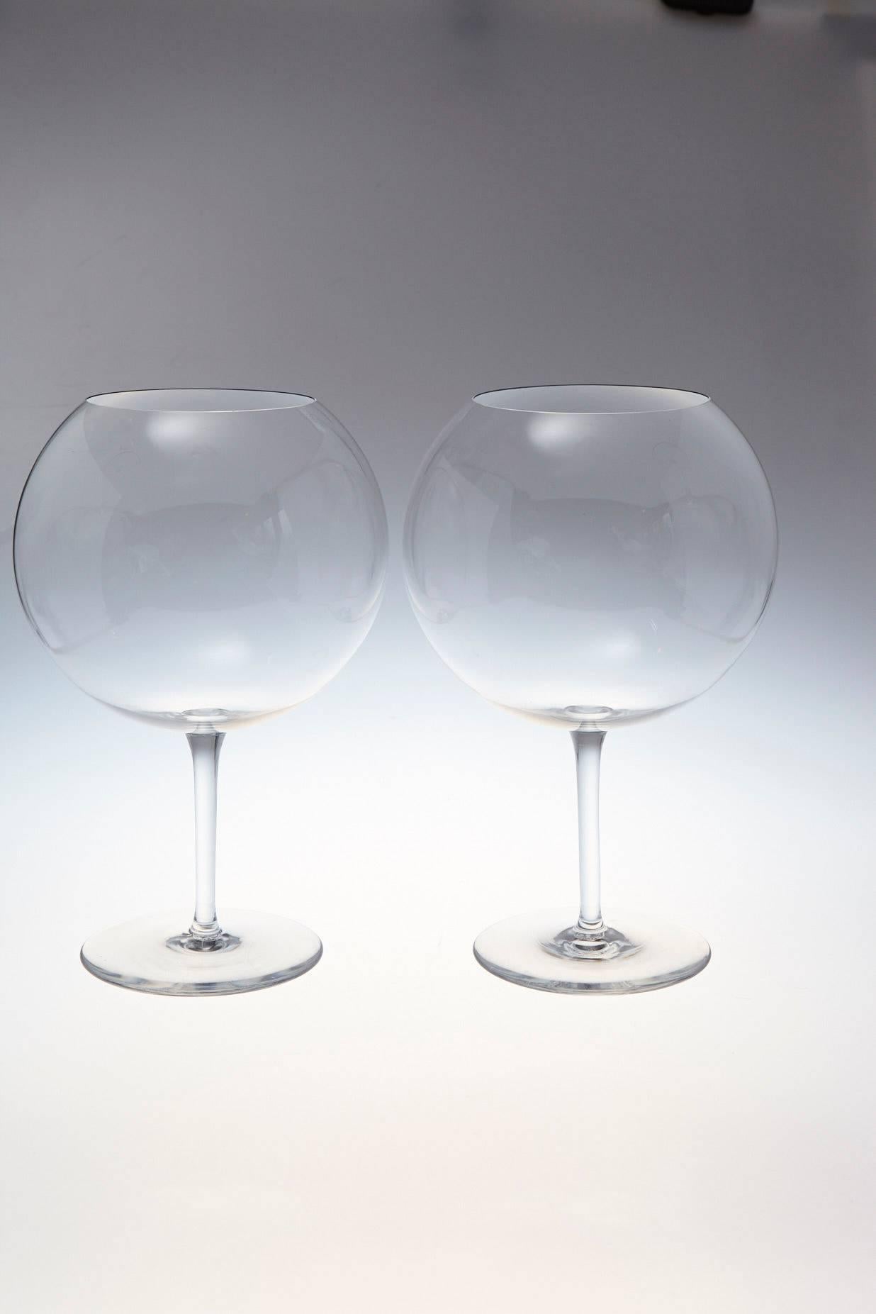 Two beautiful Baccarat crystal balloon shape tasting wine glasses with a striking Silhouette.
The ample balloon shape allows for complete oxygenation and brings out perfectly the nuances and taste of the finest grand cru.
Capacity 50.7 oz -