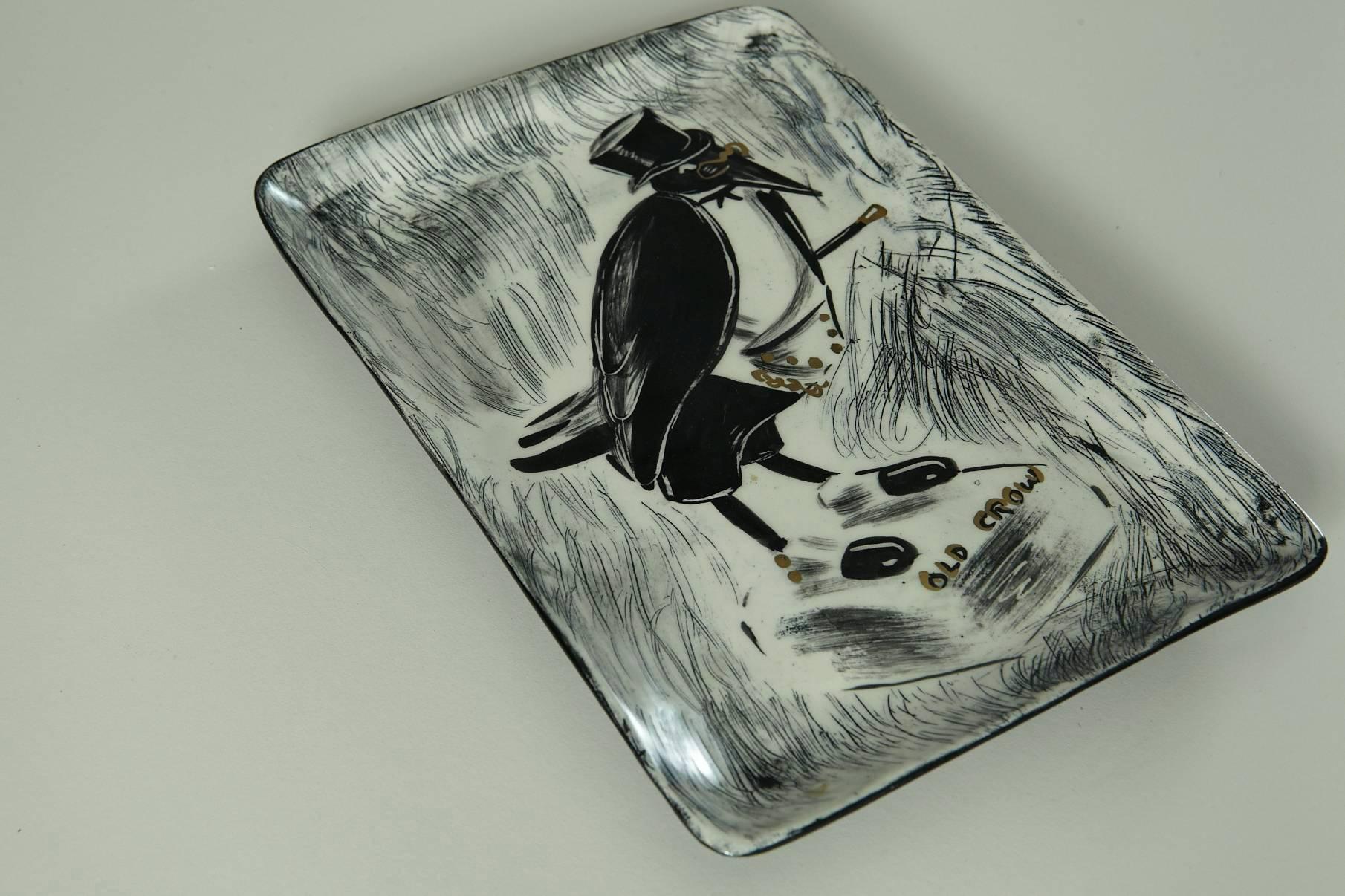 Rare ceramic piece by famous ceramicist Hedi Schoop, featuring the Old Crow Scotch advertising character. Beautiful black and white tray with some gold highlights.
About the artist:
Hedi Schoop was born in Switzerland and an accomplished dancer in
