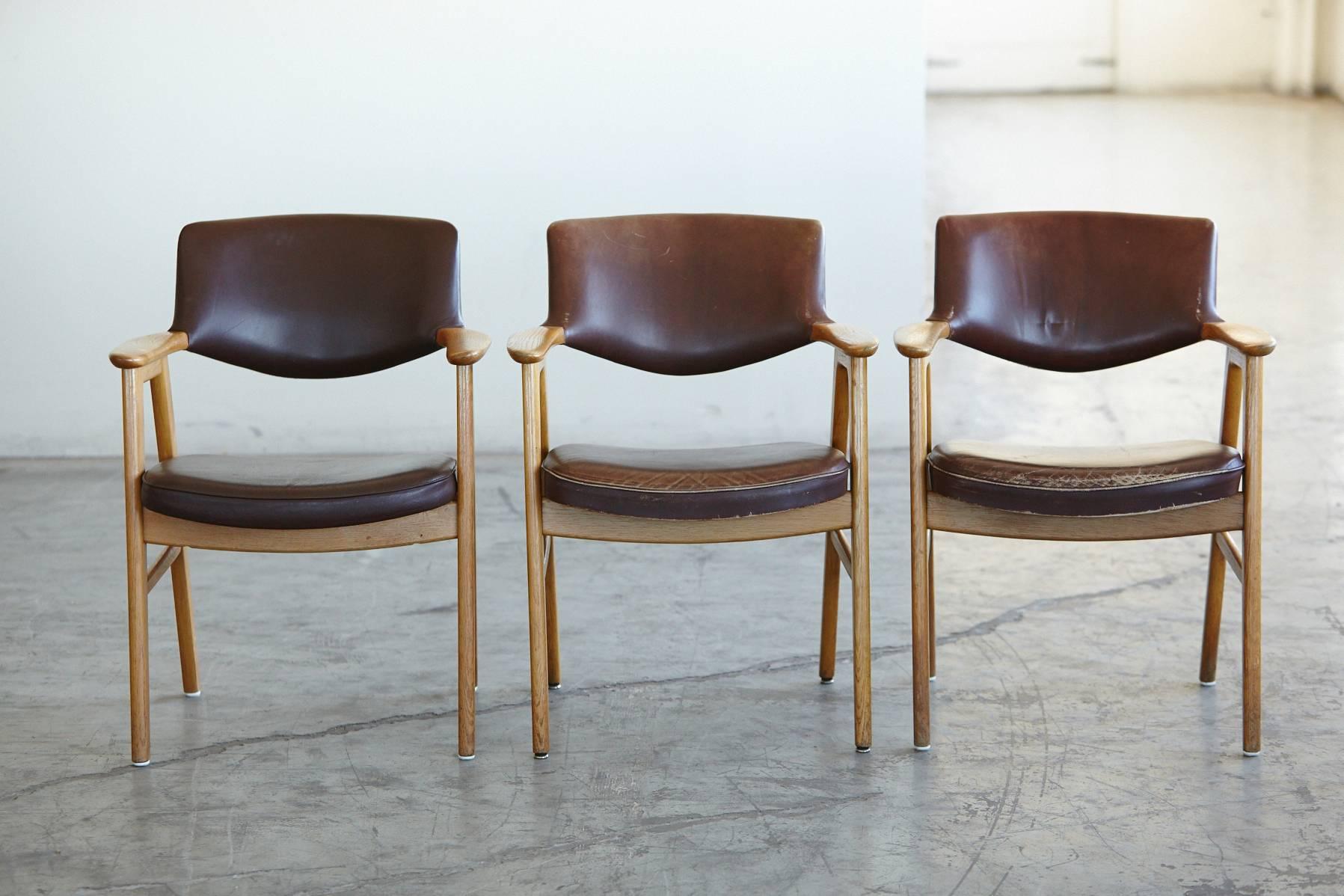 Hard to find set of six very comfortable oak and leather dining chairs with armrests and just the right amount of wear and patina. Designed by Erik Kirkegaard and manufactured by Høng Stolefabrik in 1960s.