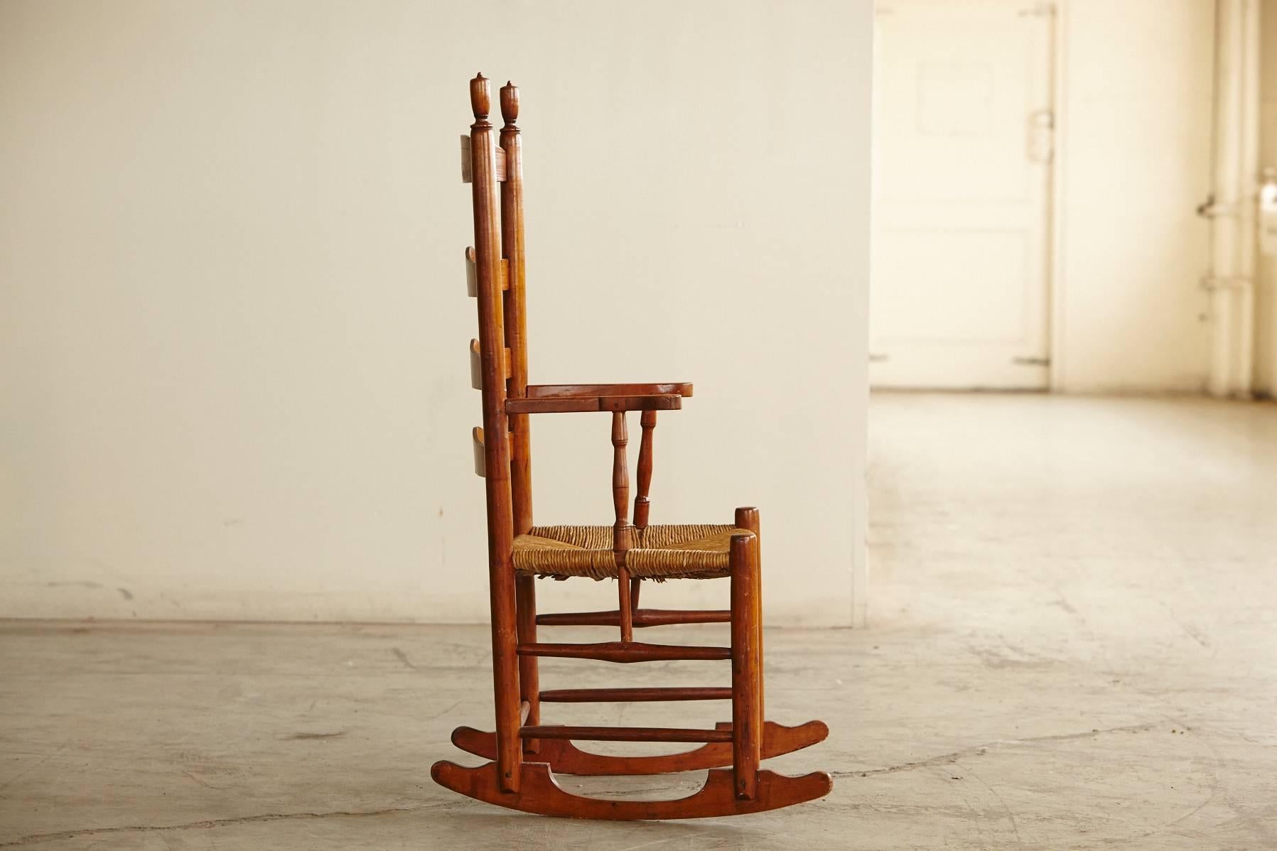 American Colonial Early American Ladder Back Rocking Chair with Rush Seat, circa 1830
