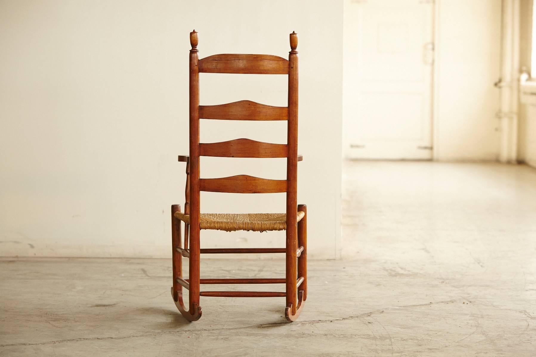 Hand-Crafted Early American Ladder Back Rocking Chair with Rush Seat, circa 1830
