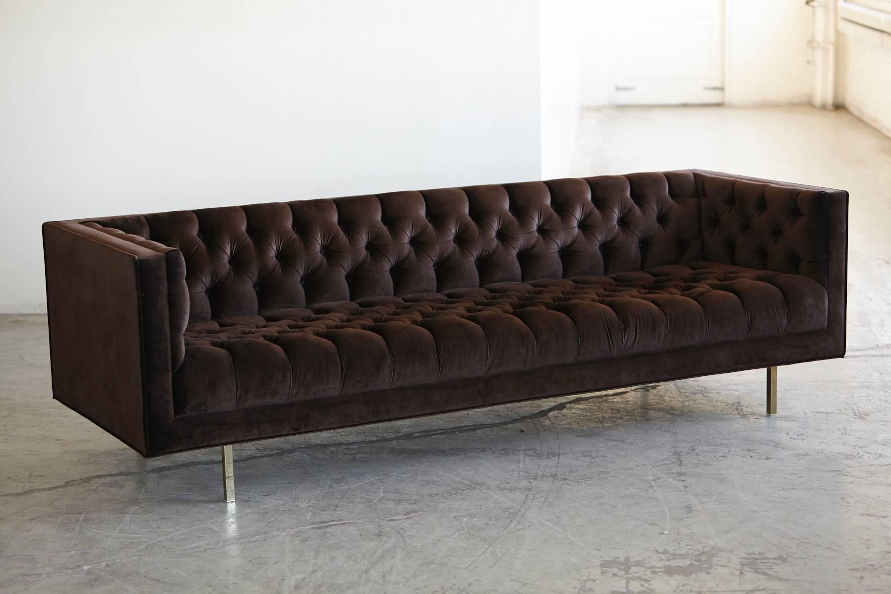 Very modernist, elegant tuxedo sofa with deep buttons and diamond like tufting in rich chocolate brown velvet and sleek brass legs. Custom made sofa with hardwood frame and attached seating and back cushion by Las Venus.
