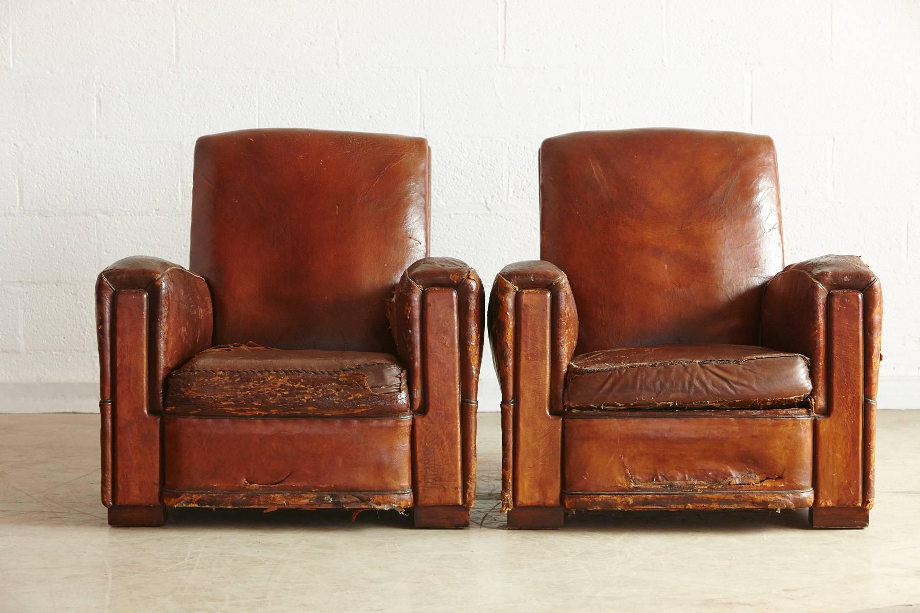Beautifully distressed and very comfortable pair of French leather fauteuils, in original condition.
Tears and rips on both chairs. Please refer to the Detailed photos, as they are part of the description. 
Very charming Wabi Sabi style.