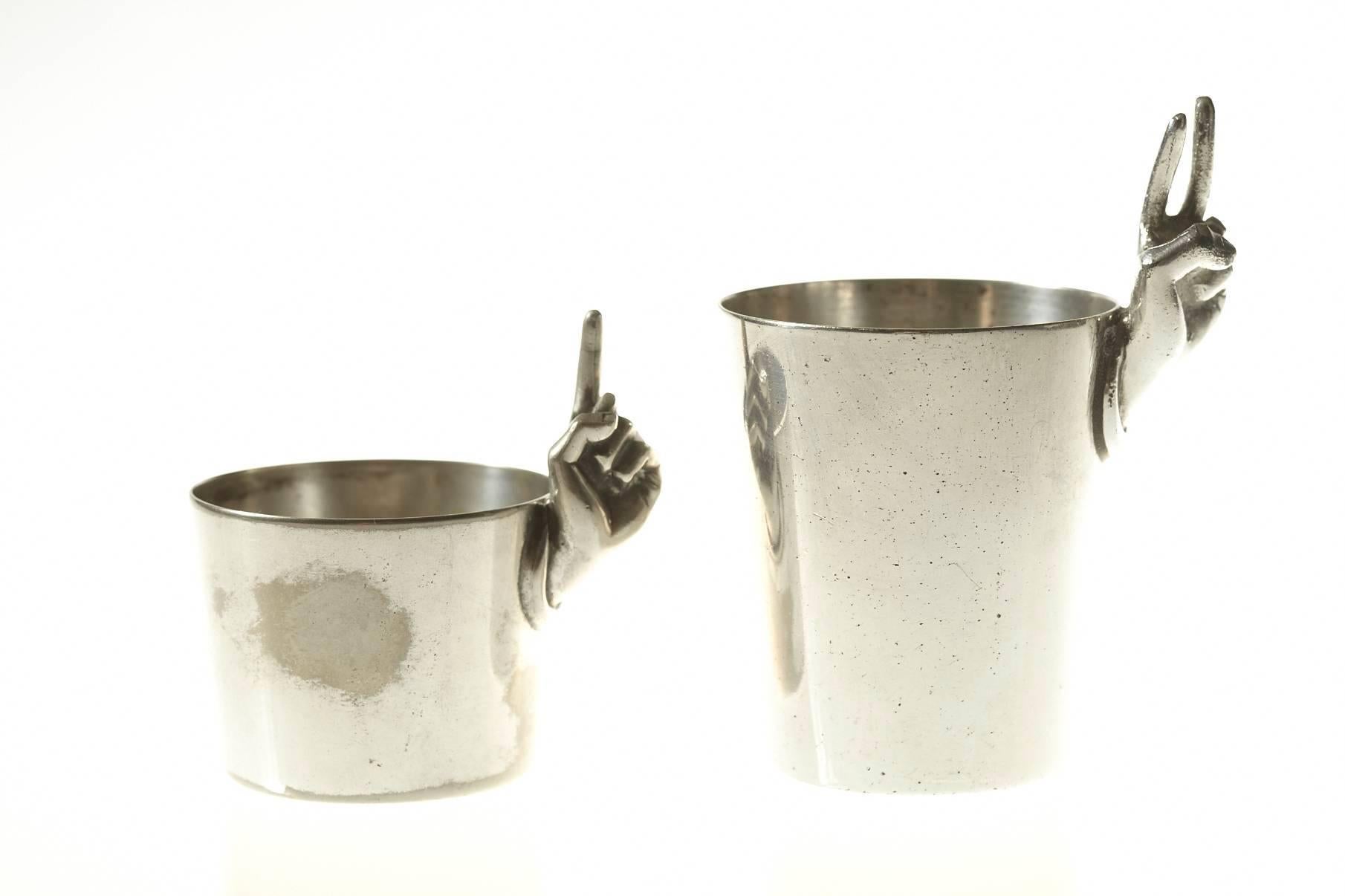 Nice vintage pair of silver plated Napier figural one (2oz) and two (40z) finger shot glasses or measuring cups.
Vintage condition, please refer to photos as they are part of the description.
Dimensions: 
small 2oz cup - diameter 1.5