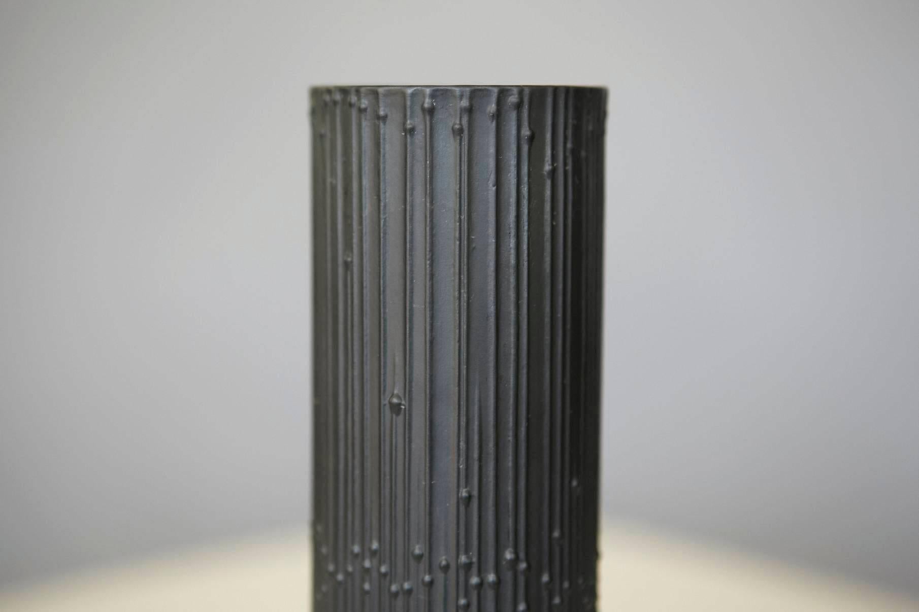 Stunning cylindrical black matte porcelain vase designed by Tapio Wirkkala for Rosenthal Studio Line. 
Sublime relief of beaded pearls running down vertical lines, gives an impression of movement.
Except condition inside and out, no chips or