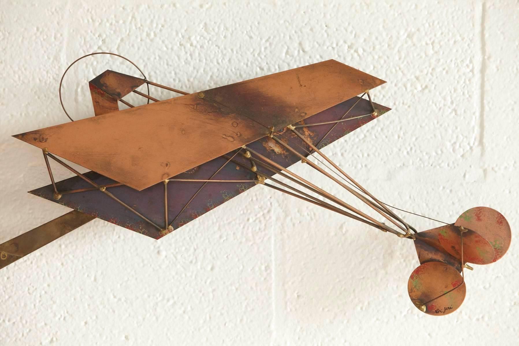 Very rare brass wall sculpture showing in detail airplanes and an airfield with building and landing strip. Impressive three-dimensional view.
Original piece in very good vintage condition with age appropriate patina.
Signed by Curtis Jere, circa