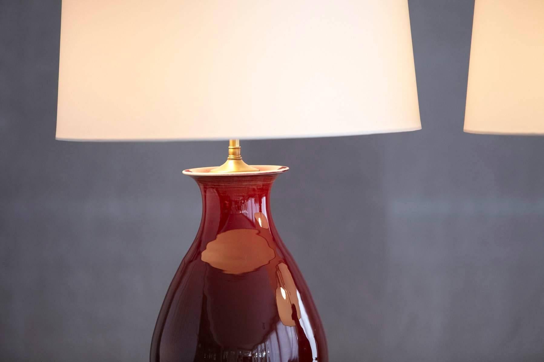 Pair of Deep Red Glazed Ceramic Lamps with New Ivory Shades, Height Adjustable 1