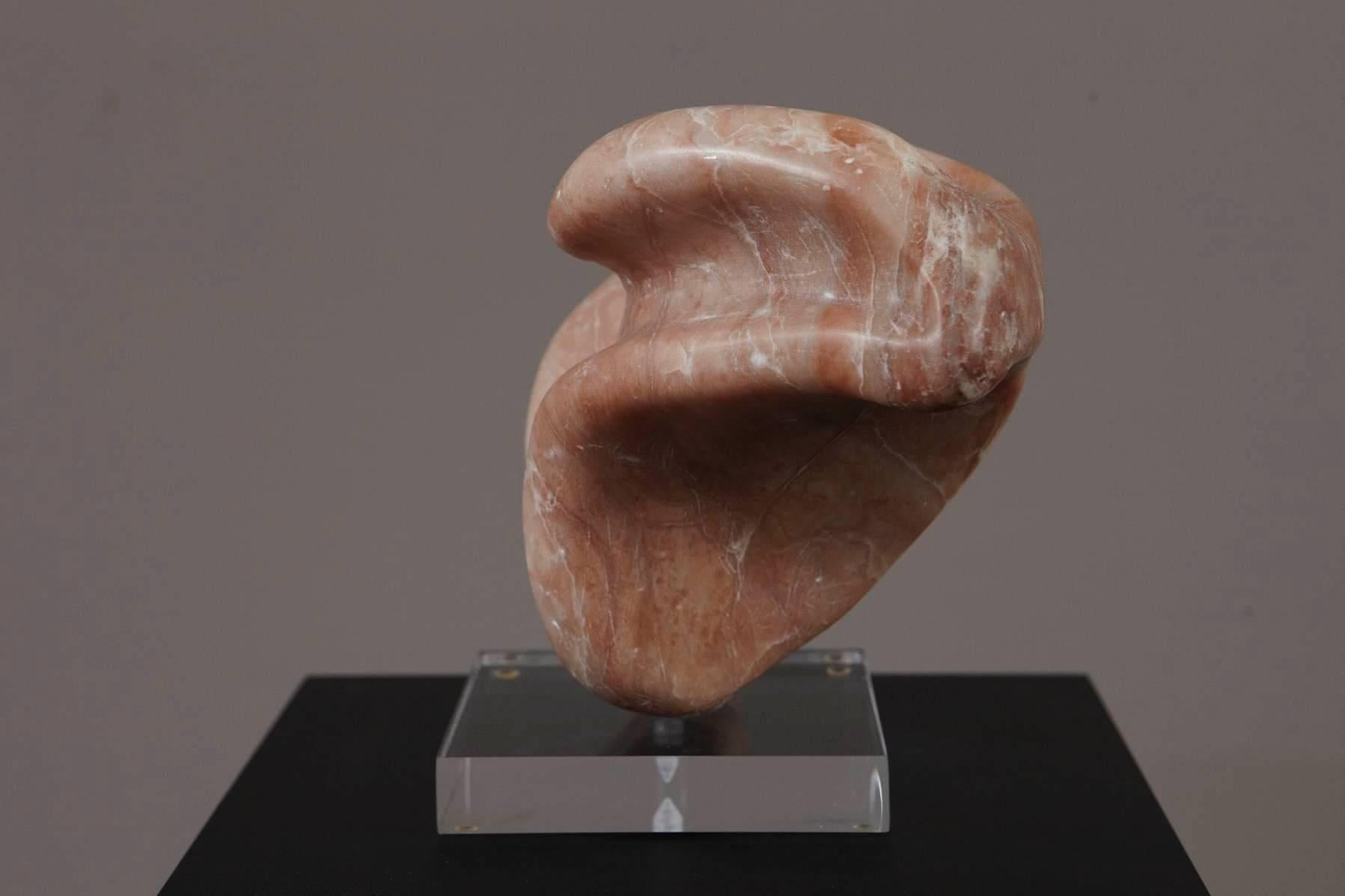 Free-form, abstract polished Portuguese pink marble sculpture on Lucite base.
The Lucite base is solid and large enough, that the sculpture can be turned in different directions without tilting. Marble and Lucite in very good condition.