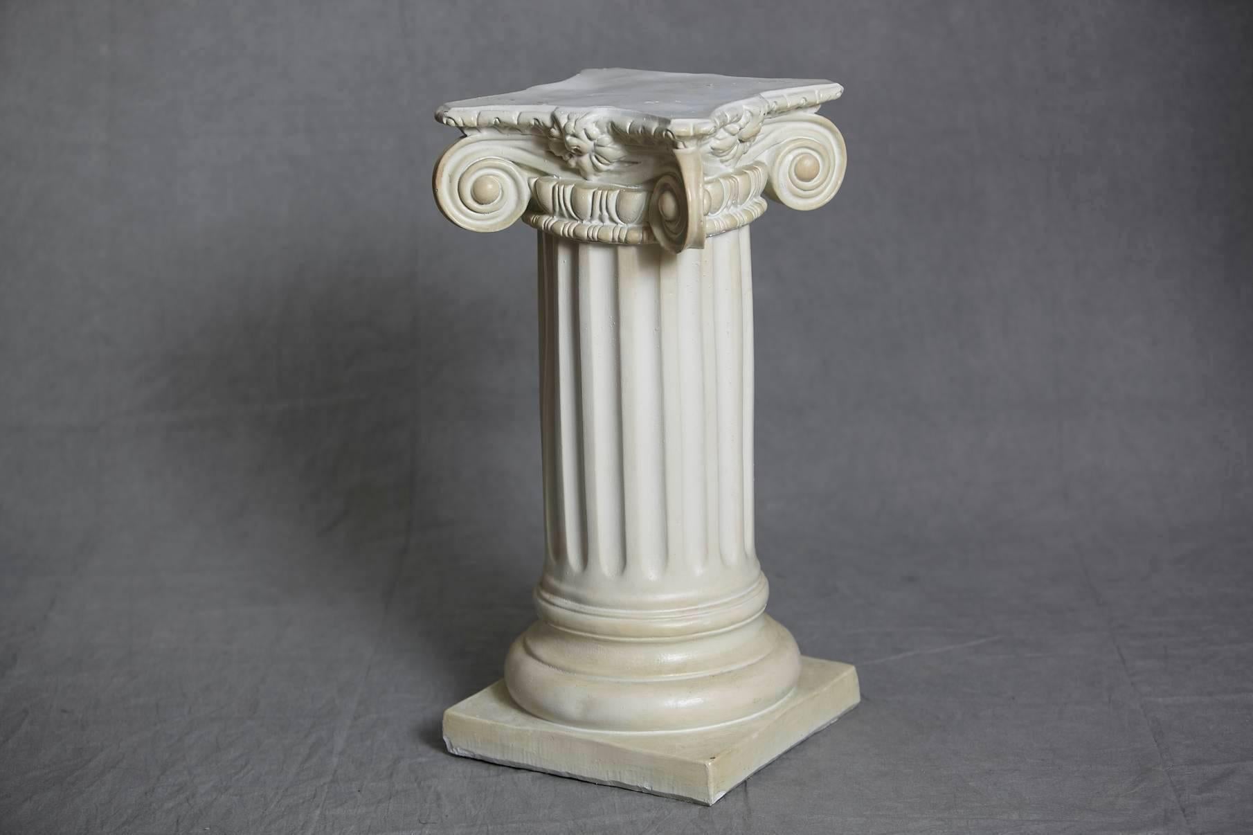 Beautiful Greek style plaster pedestal or column with the chapiteau in ionic order, very charming patina.