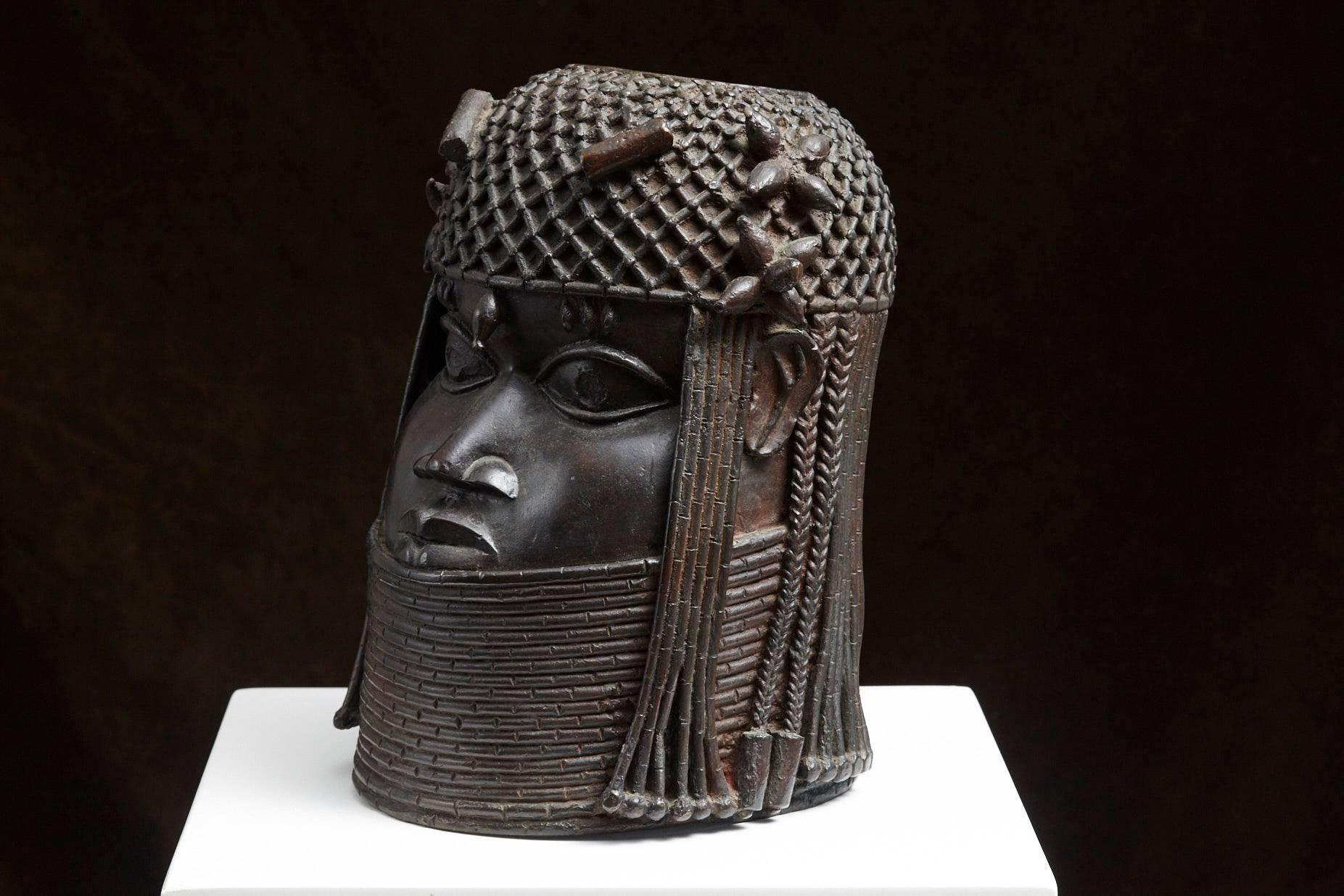Benin Bronze Memorial Head from the Nelson Rockefeller Collection, 1978. The sculpture is stamped on the back.

'The Nelson Rockefeller Collection' was a line of about 100 high quality pieces of furniture and objects reproduced from the originals he