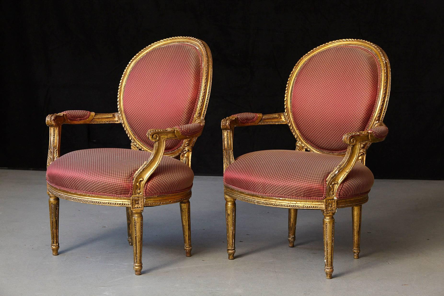 Beautiful pair of French Louis XVI style gilded fauteuils with carved relief ornaments. Some loss to the gild, please refer to the photos. Upholstery in very good condition.
Very Wabi-Sabi Style.