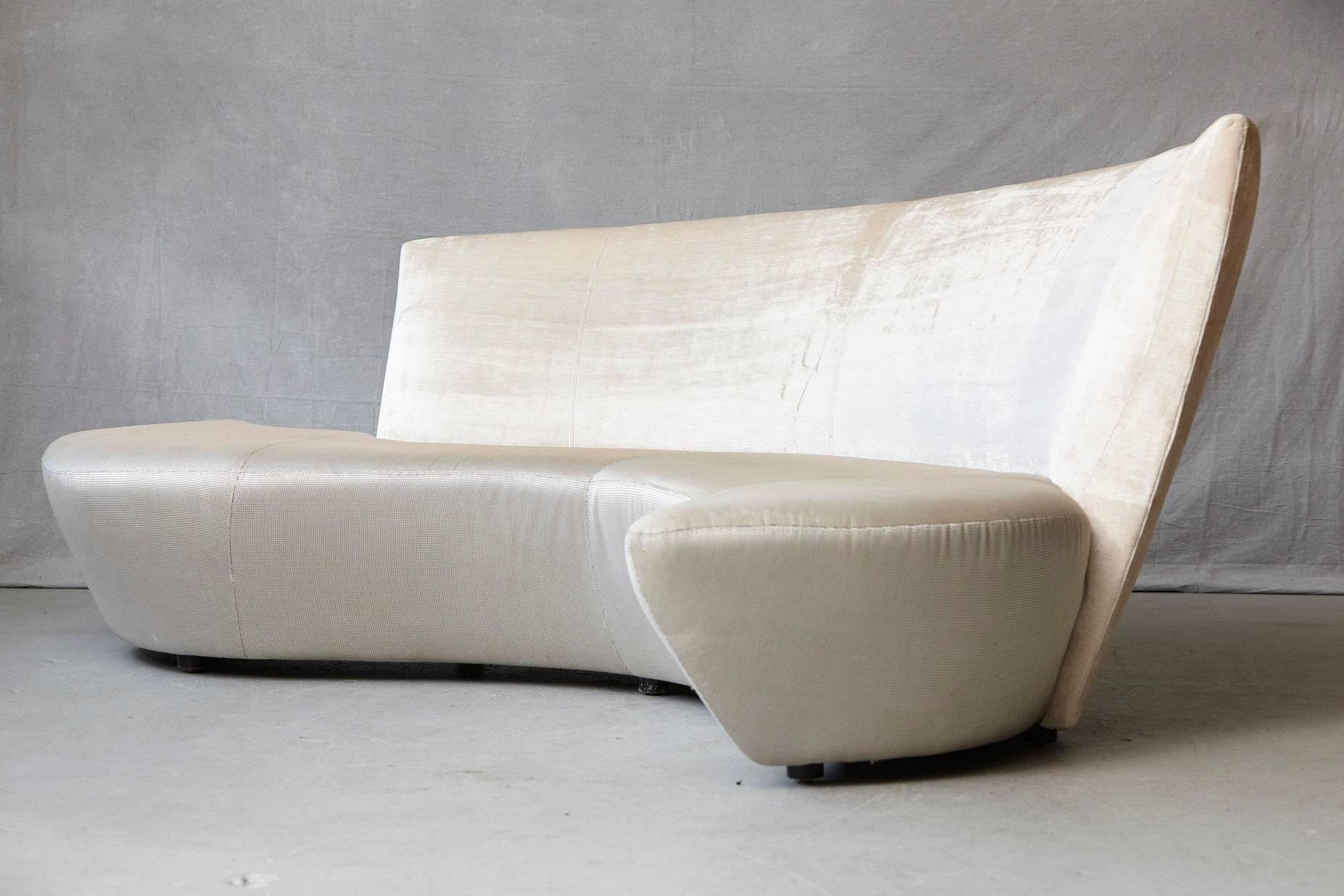 Sculptural sofa in a two-tone fabric combination of an ivory striae velvet for the back and a textured beige / sand tone fabric for the seat surface.
The name Bilbao sofa derived from Frank Gehry's famous Guggenheim Museum in Bilbao, which was the