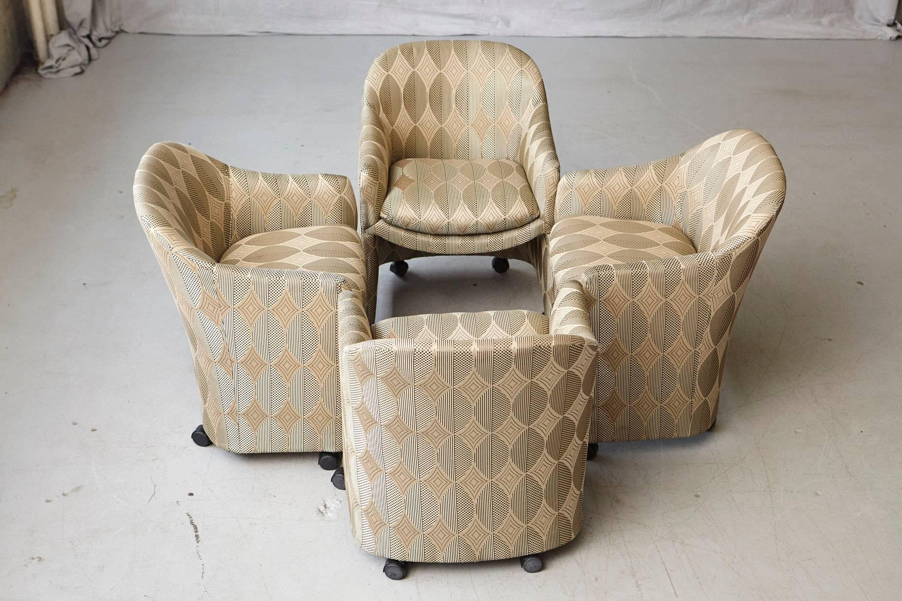 Lovely set of four Milo Baughman barrel dining armchairs on casters with a graphic upholstery pattern for Thayer Coggin.