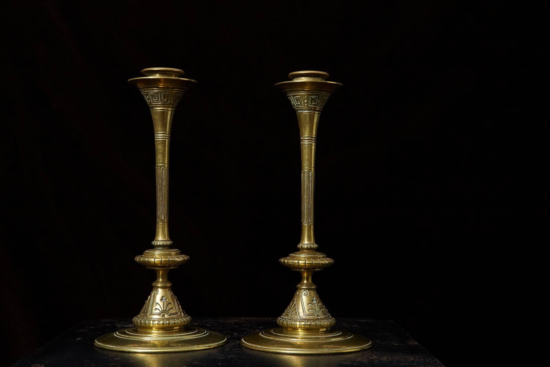 19th century Aesthetic Movement beautifully cast fine brass candlesticks with embossed, egg and dart, Greek Key and fluted design, having a trumpet form, in very good condition.

  