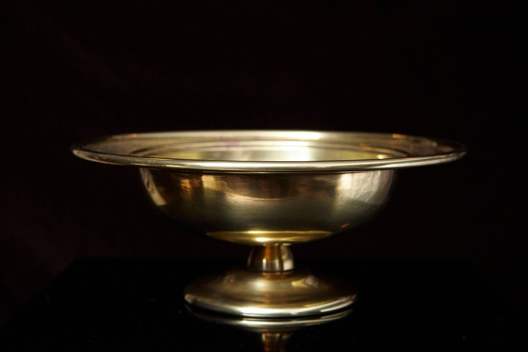 Louis C. Tiffany Furnaces Inc. favrile bronze bowl raised on circular foot, with rounded gallery, monogram in centre and dated 1880-1930.
Foundry marks in two places: Louis C. Tiffany Furnaces, Inc., Favrile 300A
Recalling the Old English word
