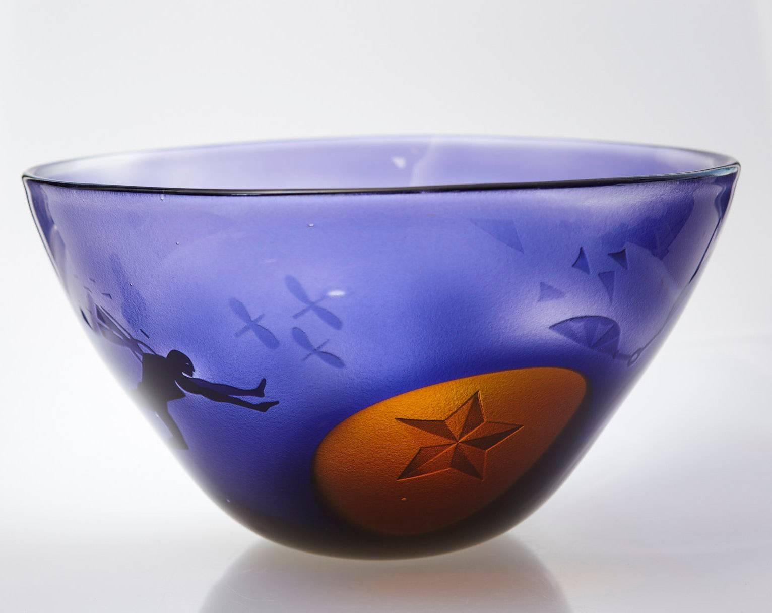Outstanding blue art glass vase with sand blasted surrealistic, dream like sequences eternalized in glass.
This bowl is a unique piece of art from the the Kosta Unik Collection # 7008 by Swedish Glass Artist Bertil Vallien, (Swedish 1938).
The