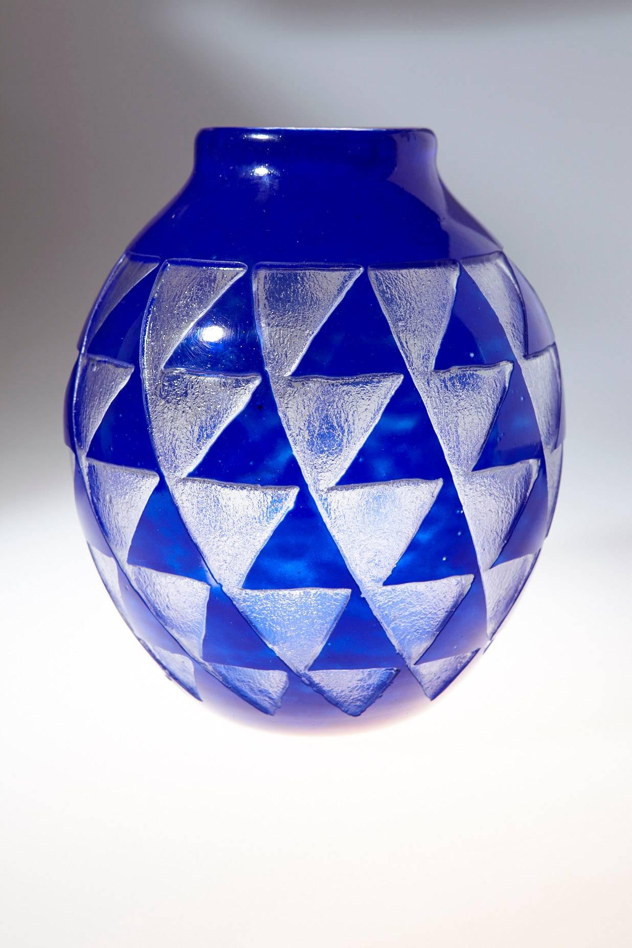 Beautiful French Art Deco glass vase by David Gueron (1892 - 1950) (Degué) for Verrerie d'Art Degué in Paris. The vase is made in a stunning cobalt blue cameo sandblasted glass featuring a geometric pattern of triangles.
Degué used a sandblasting