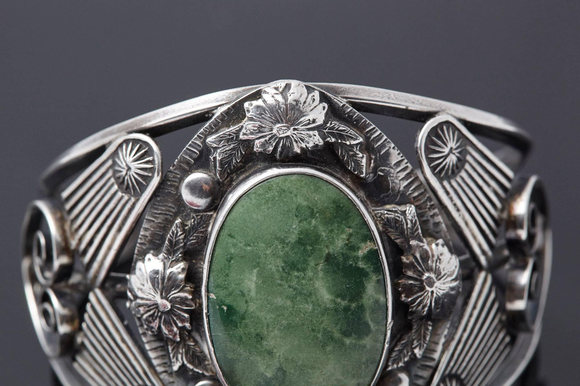 Mid-Century Modern Sterling Cuff with Large Green Centre Turquoise and Elaborated Reliefs, 1940s