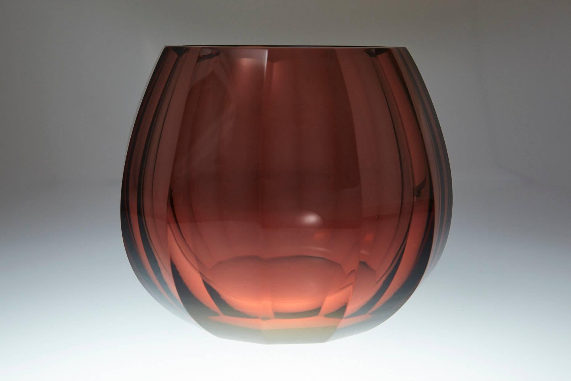 Amber hand-cut and hand polished crystal vase. The piece is firmly attributed to Josef Hoffmann for Moser & Söhne, and signed Moser, circa 1920s.
The vase is in very good condition, no chips or fleabites on the cut edges, no repairs, one minor chip