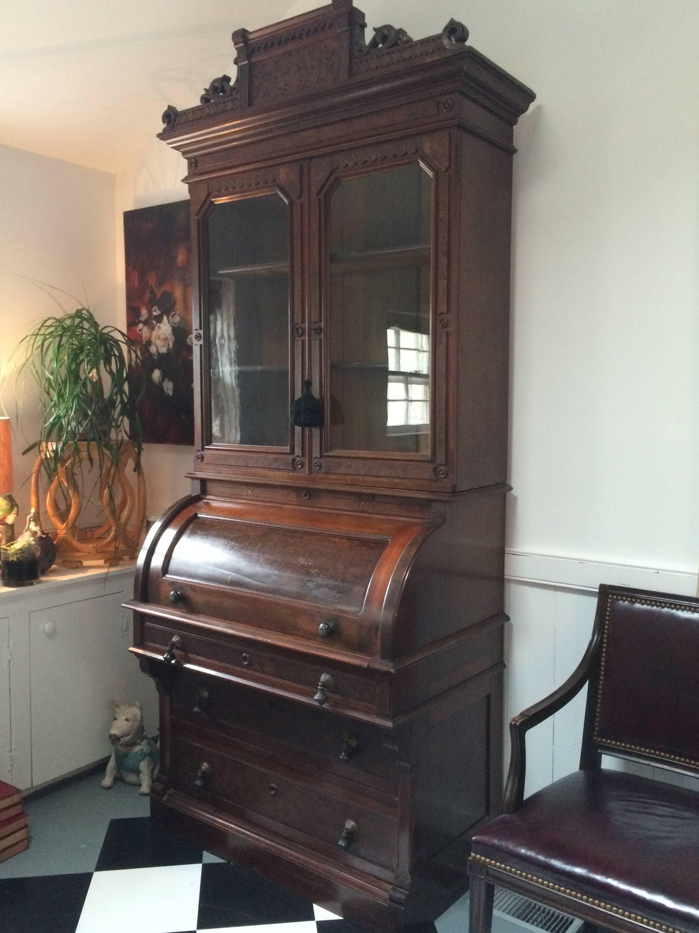 19th century American cylinder desk with bookcase and drawers.