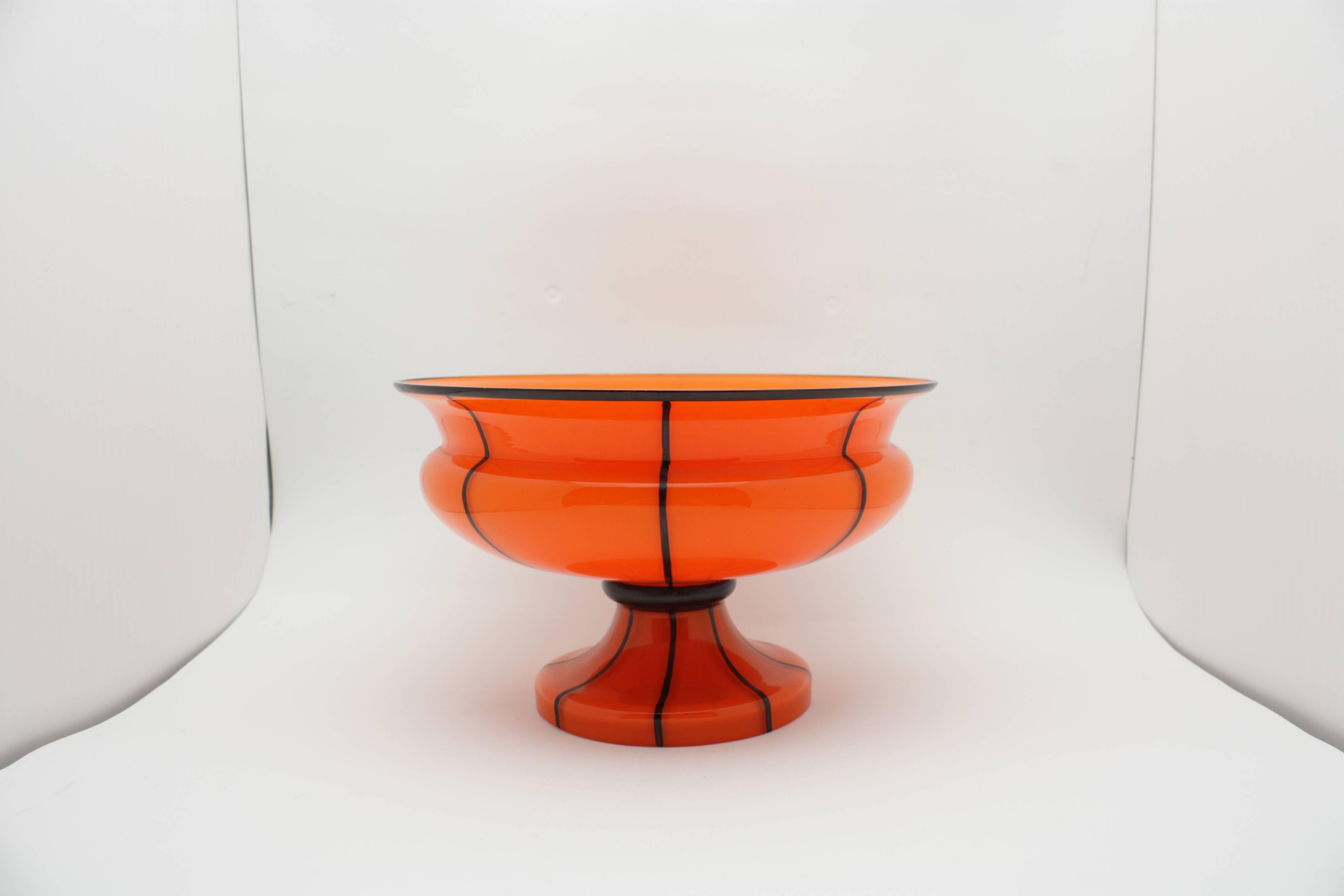 Michael Powolny (Austrian, 1871-1954), a Loetz compote. Cased glass compote in orange glass with clear glass over. Black enameled vertical striped along the exterior.