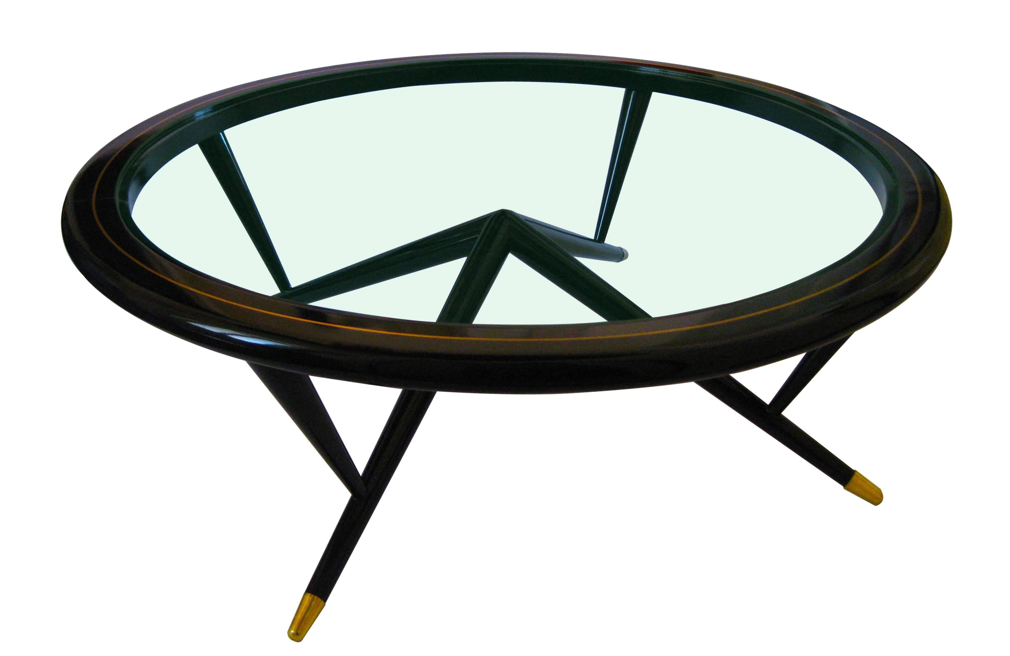 Glass center table of black lacquered mahogany adorned with brass inlay and sabots.