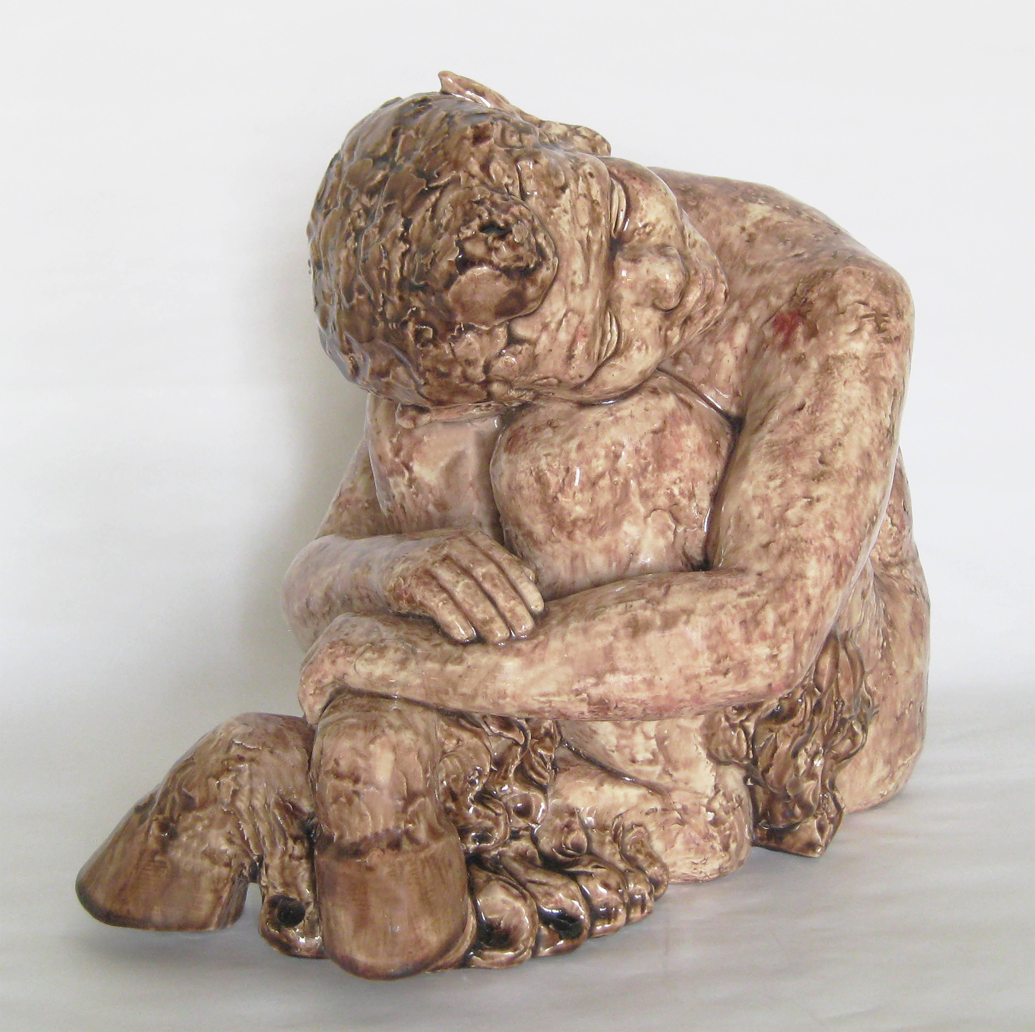 Lovely and impressively large and heavy ceramic of a waking faun child.  A piece from the inception of the Art Deco period; marked 