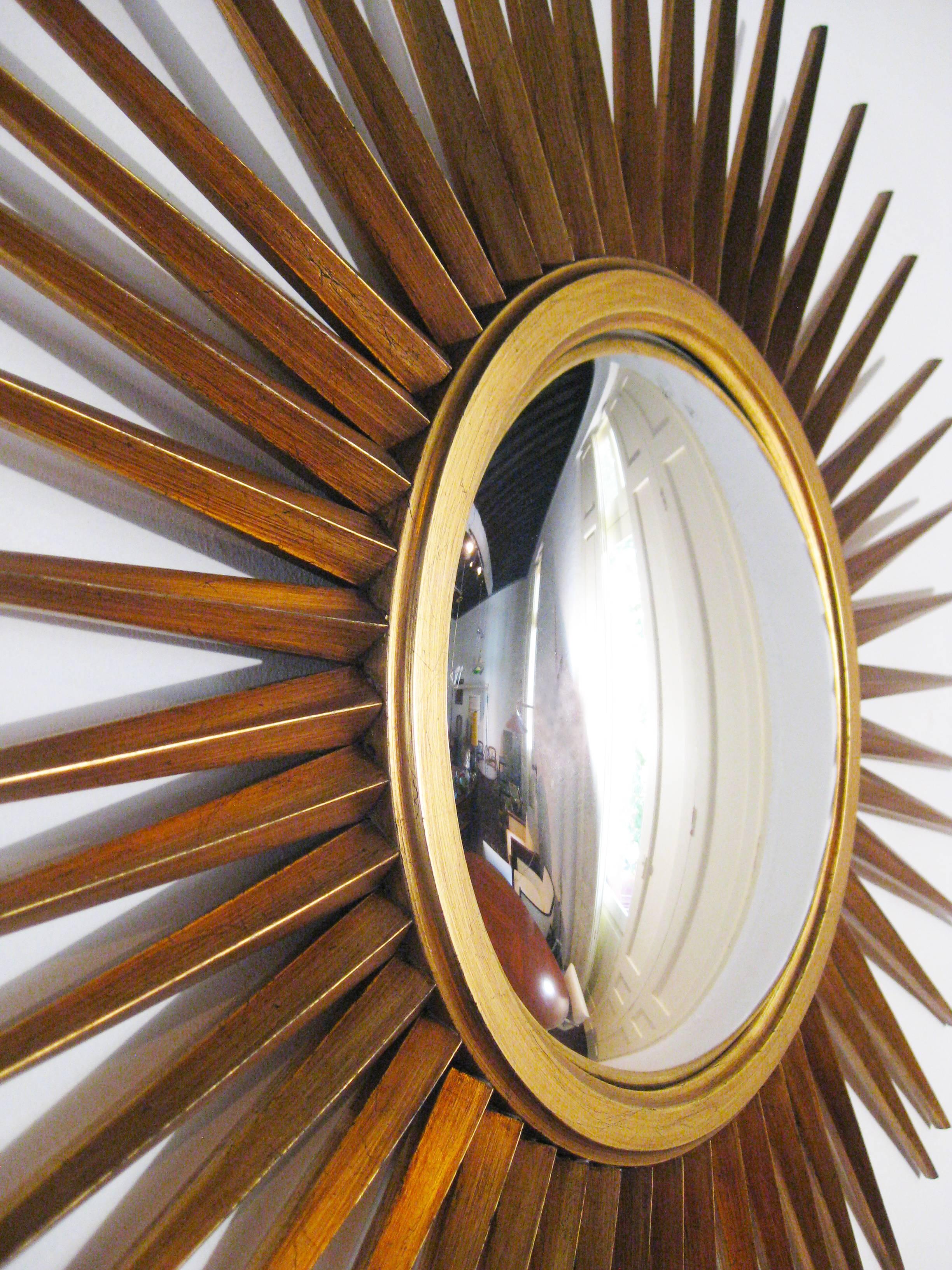 This spectacular mirror has a formidable convex center surrounded by intricate rays. Designed by Pani in the 1950s, it is gilded in gold leaf and without blemish, all original.

Younger brother of the celebrated architect Mario Pani, Arturo Pani