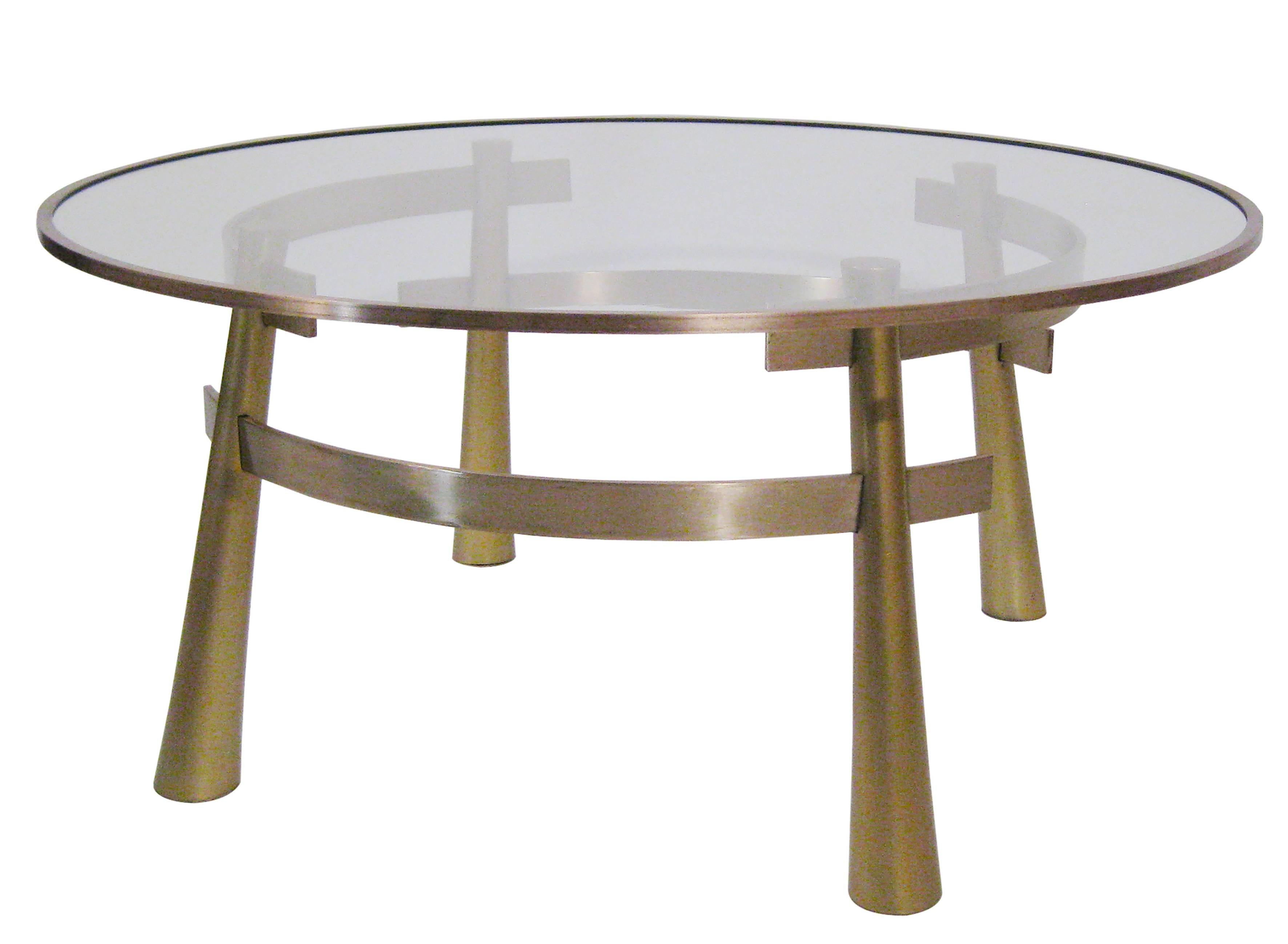 
Brass and glass-top table that subtlety reflects the Eastern tastes from the sixties. 