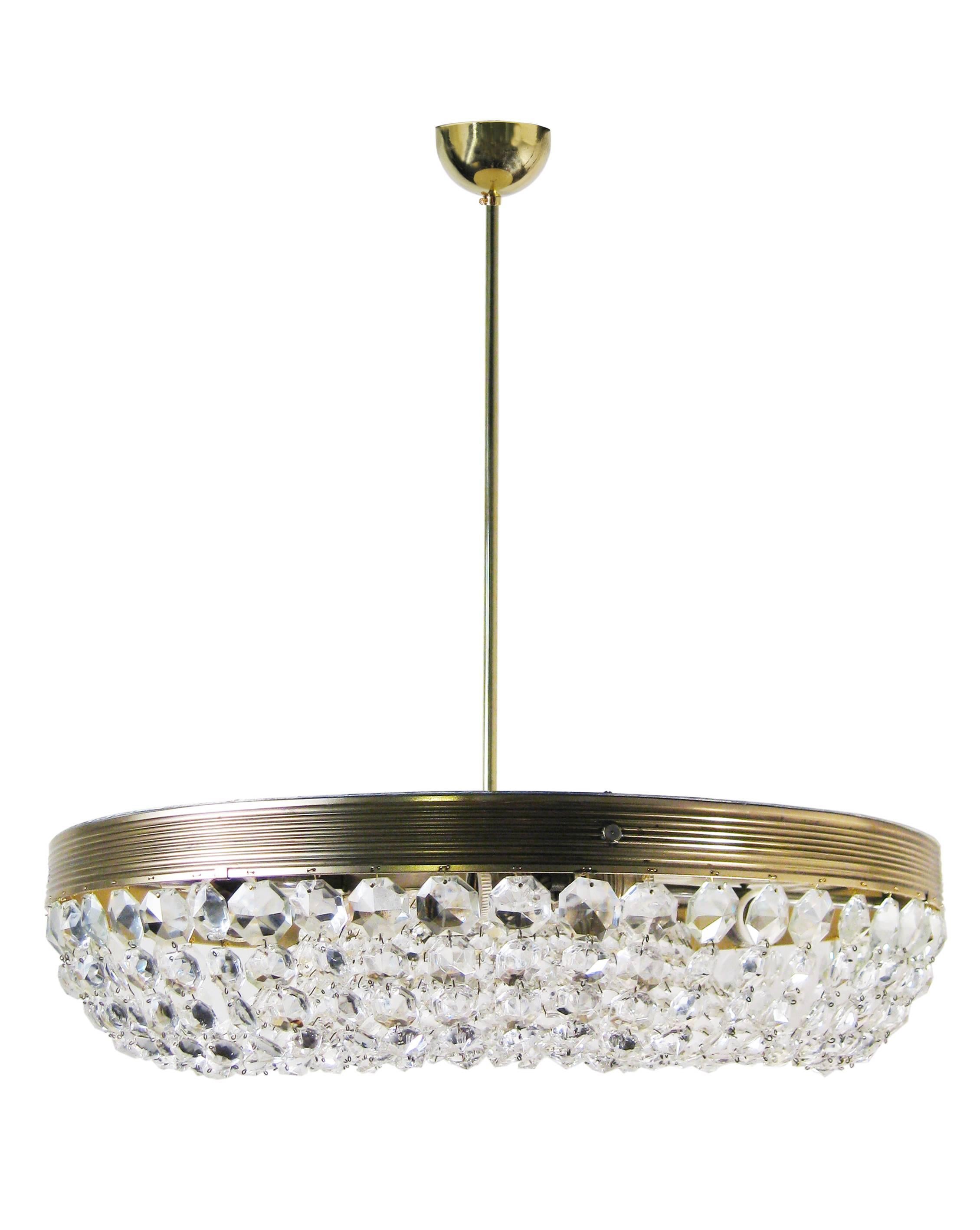 This lovely light is a more contemporary version of Bakalowits & Sohne's original and extremely successful, "basket" model. Its striated brass frame is ornamented with diamond-shaped crystals, hung in graduated loops in the company's